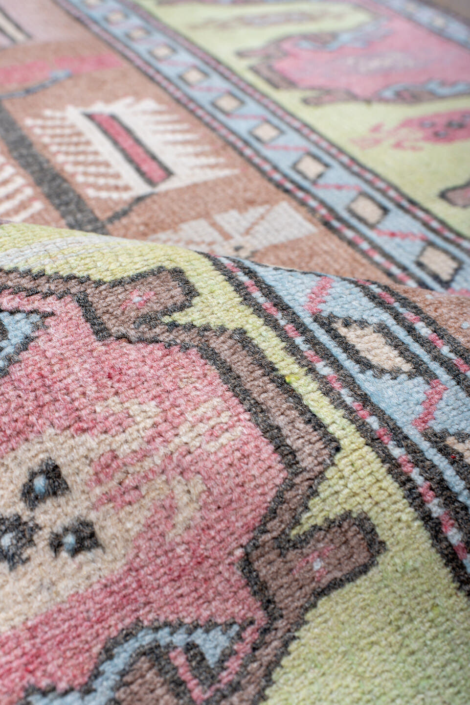2' x 4' one-of-a-kind handmade antique Anatolian small size rug. Color palette: blush, pale_yellow, sky_blue, brown, ivory