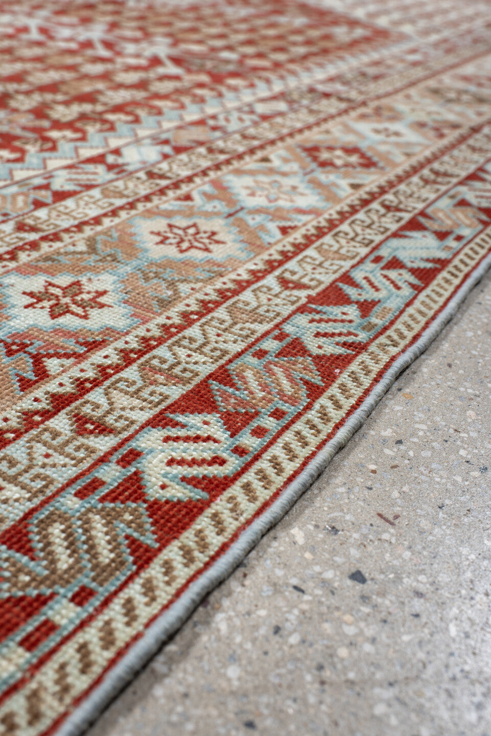 6' x 9' one-of-a-kind handmade antique Shiraz medium size rug. Color palette: rust, ivory, terra cotta, camel, light blue