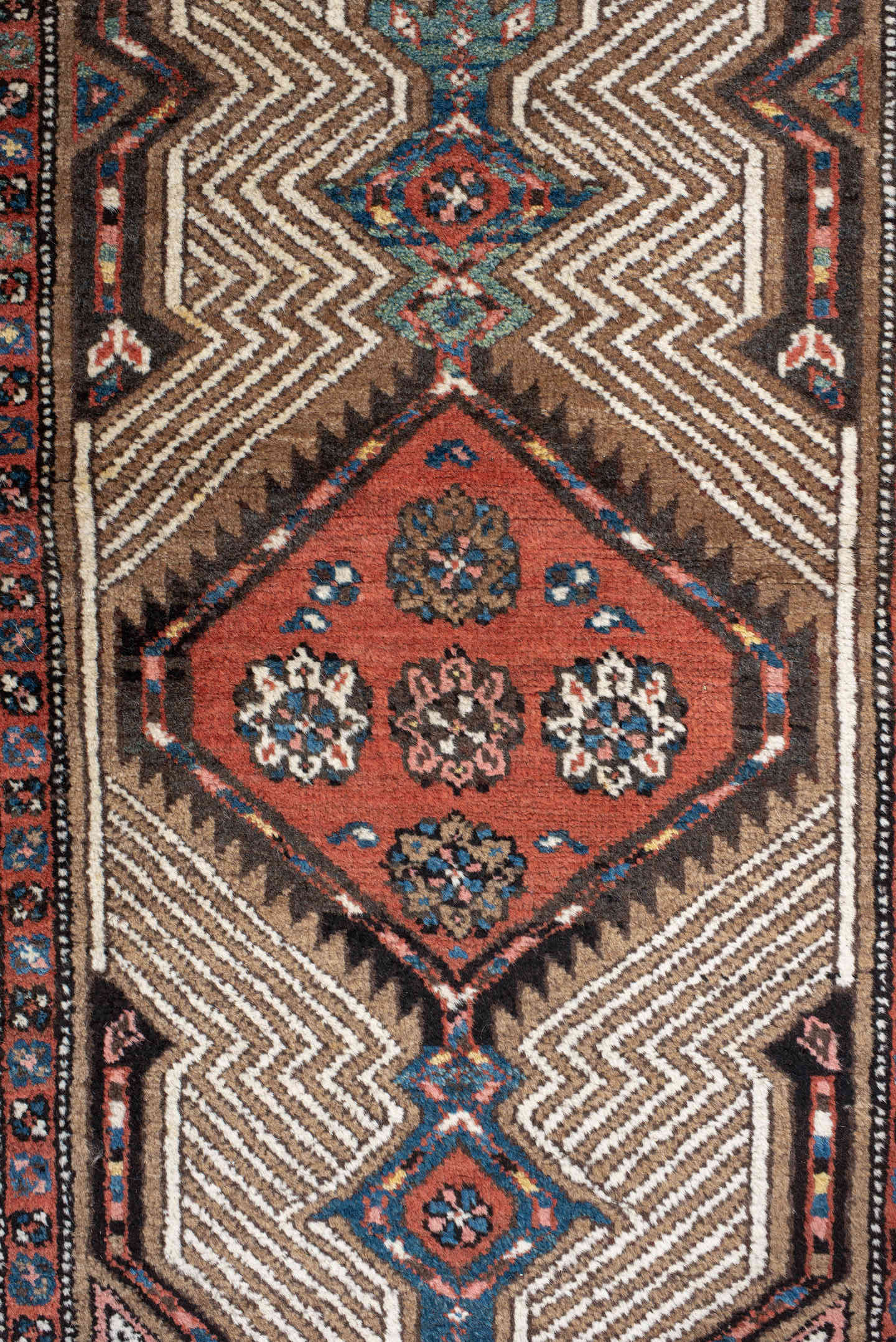 3' x 16' one-of-a-kind handmade antique Sarab runner rug. Color palette: ivory, rust, red, indigo, camel, navy, brown