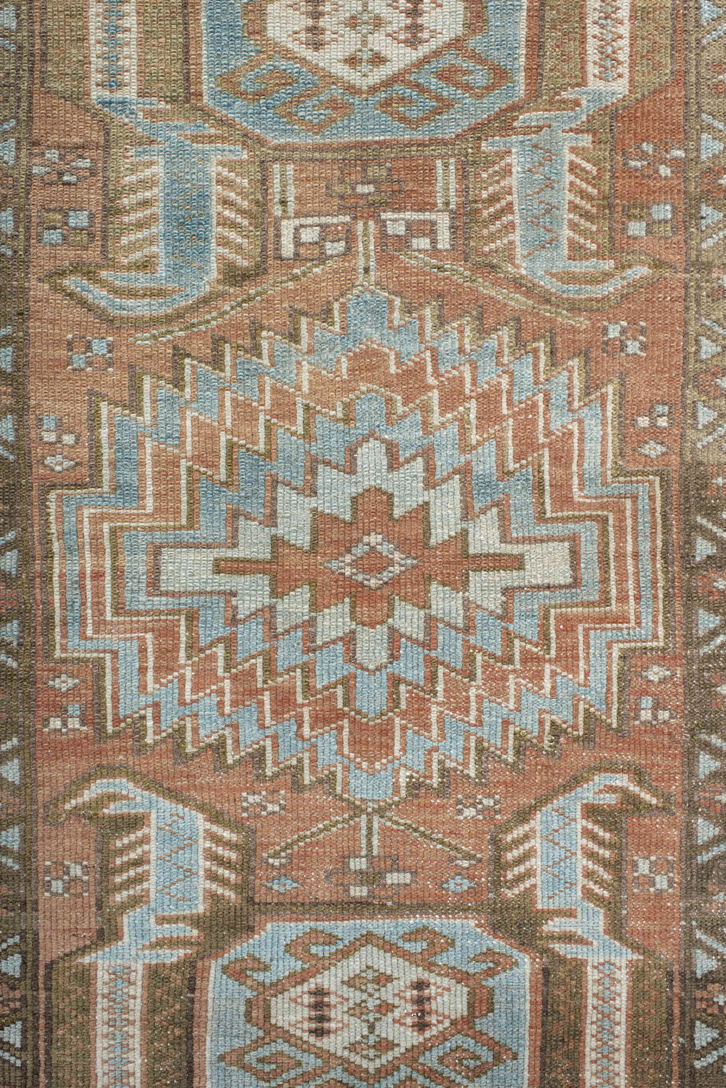 3' x 9' one-of-a-kind handmade antique Heriz runner rug. Color palette: terra cotta, sky blue, ivory, taupe, charcoal, sage