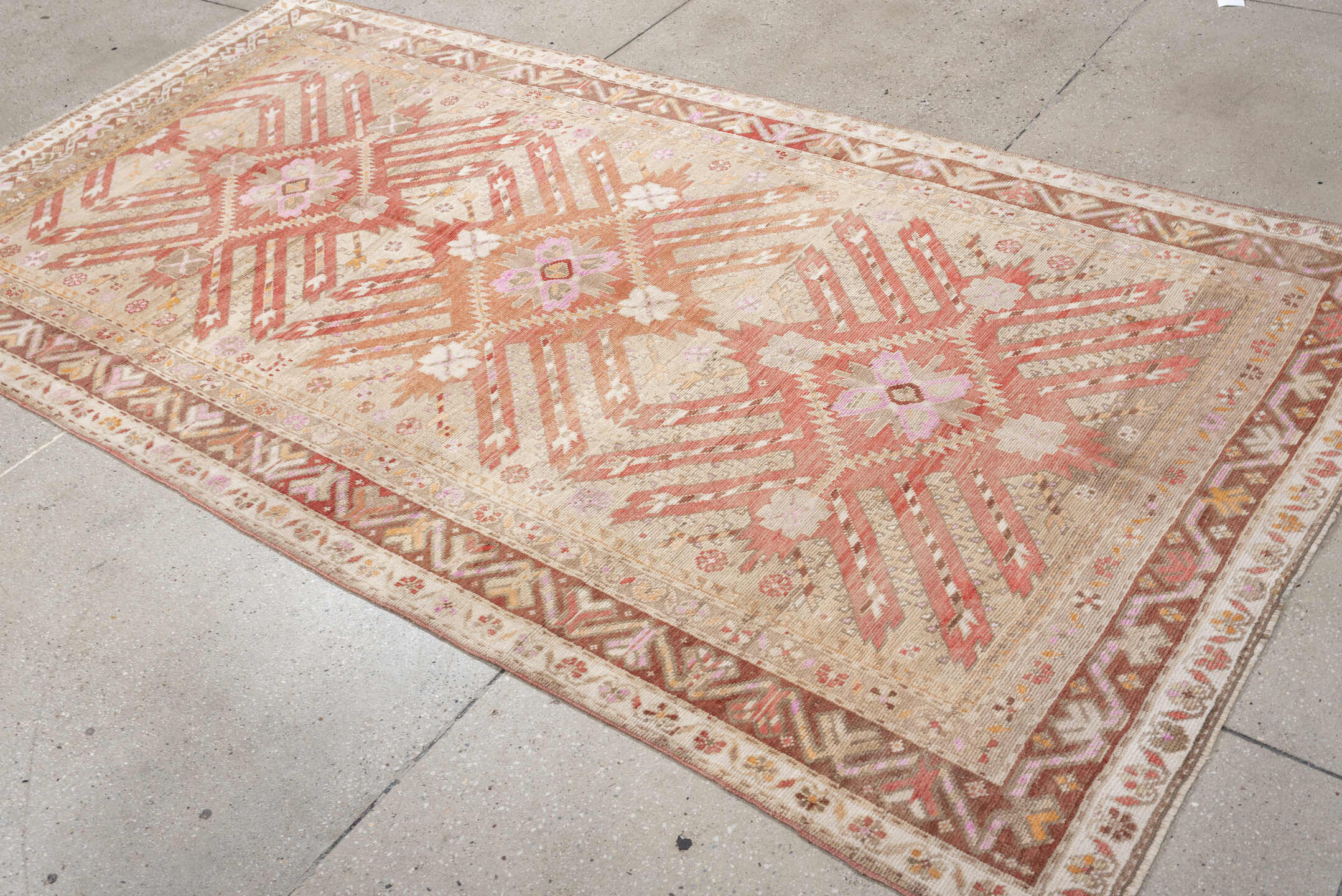 4' x 9' one-of-a-kind handmade antique Caucasian medium size rug. Color palette: ivory, terracotta, rose, taupe, blush