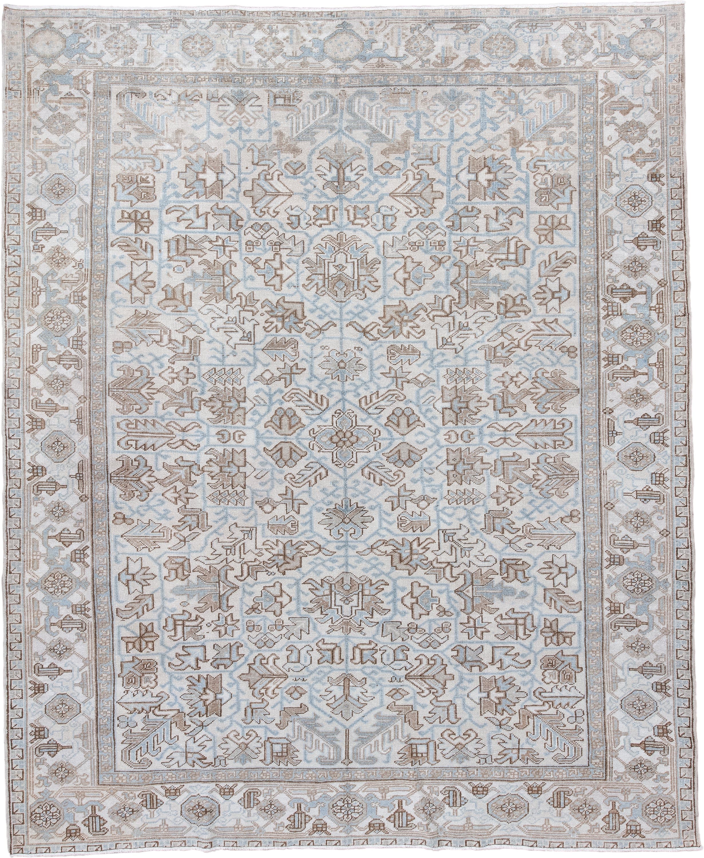 8' x 9' one-of-a-kind handmade antique Heriz rug. Color palette: ivory, pale blue, taupe, beige, light brown, light blue