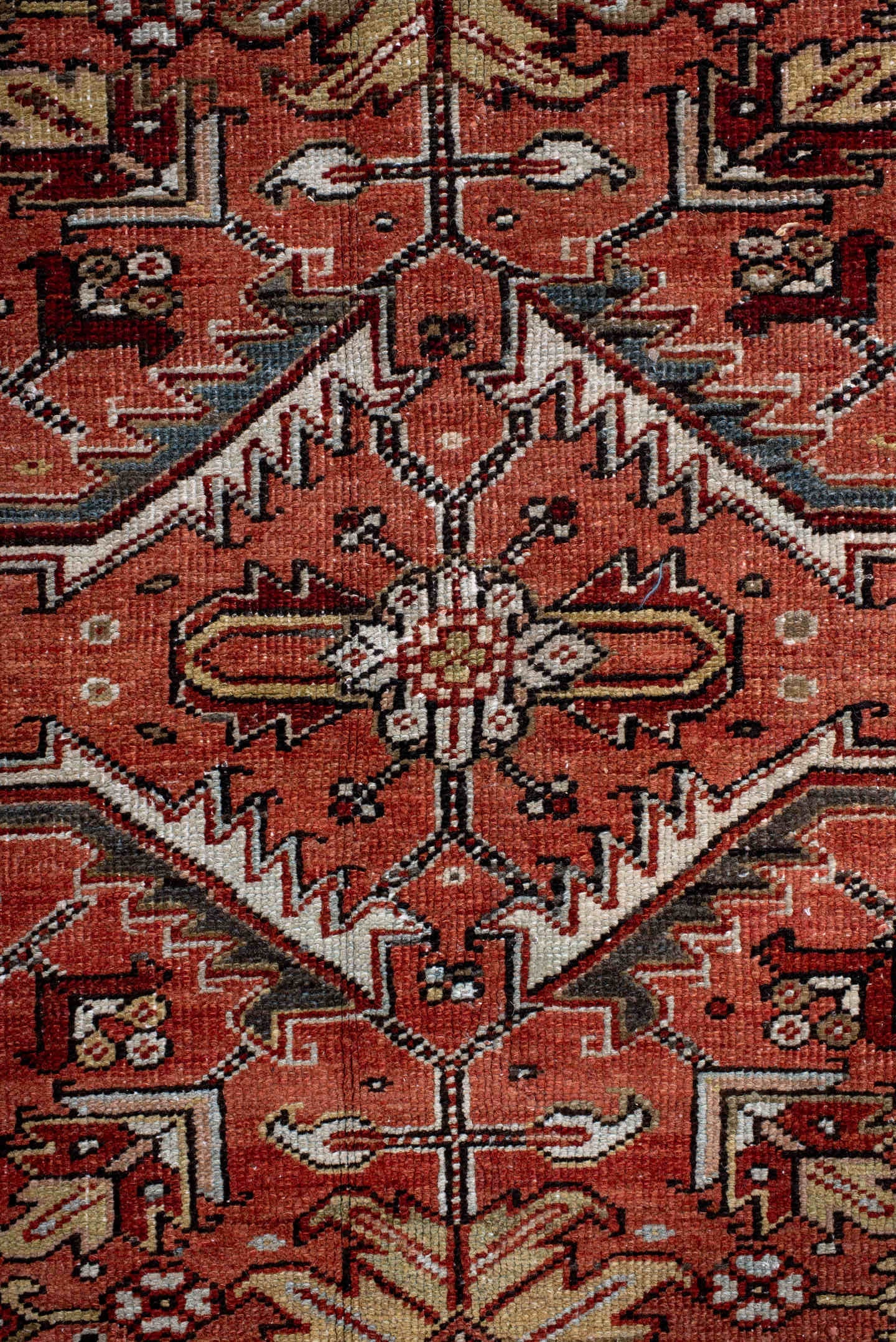 6' x 9' one-of-a-kind handmade antique Heriz rug. Color palette: terra cotta, rust, sky blue, ivory, charcoal, camel