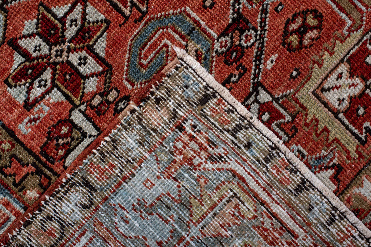 6' x 9' one-of-a-kind handmade antique Heriz rug. Color palette: terra cotta, rust, sky blue, ivory, charcoal, camel