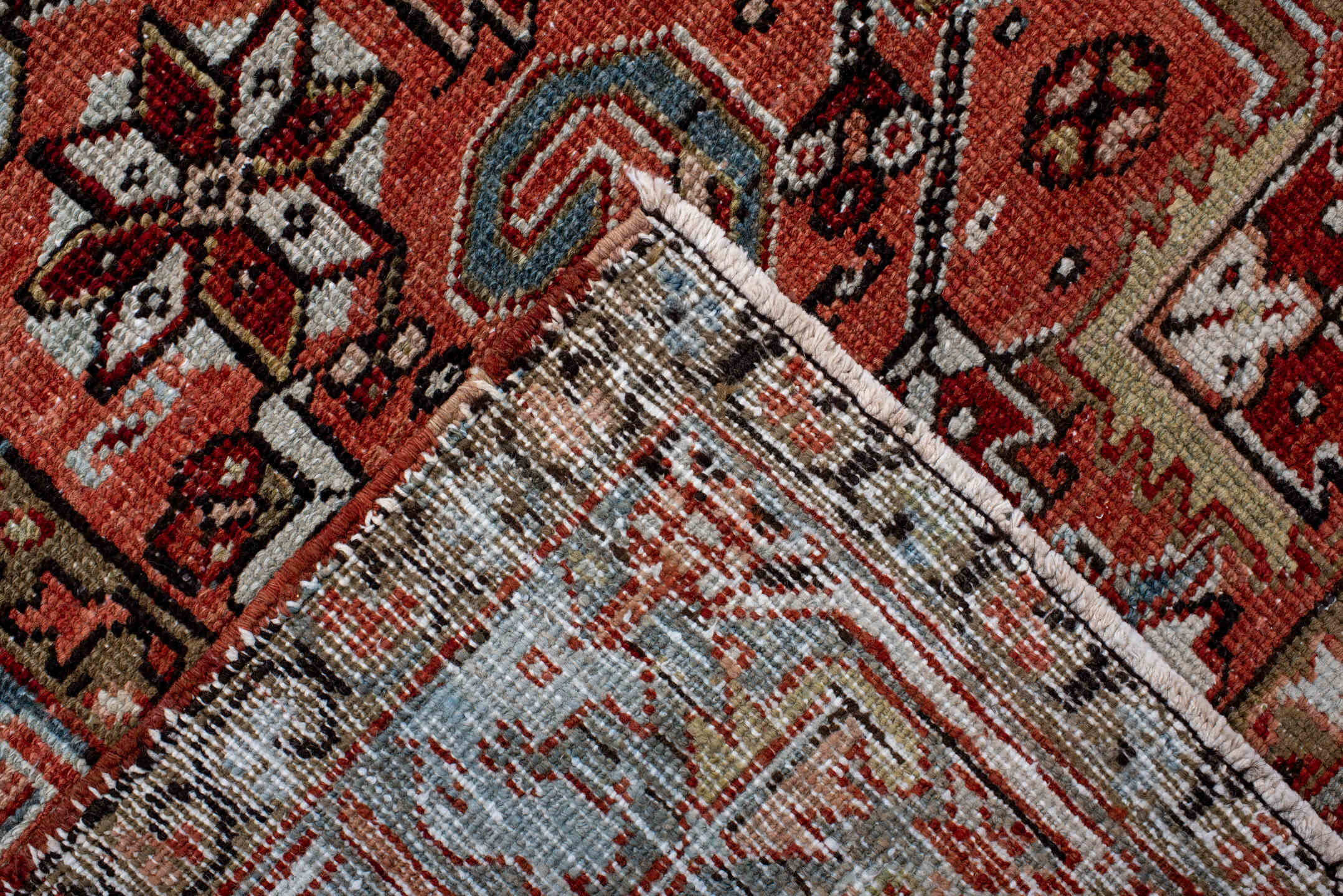 6' x 9' one-of-a-kind handmade antique Heriz rug. Color palette: terra cotta, rust, sky blue, ivory, charcoal, camel