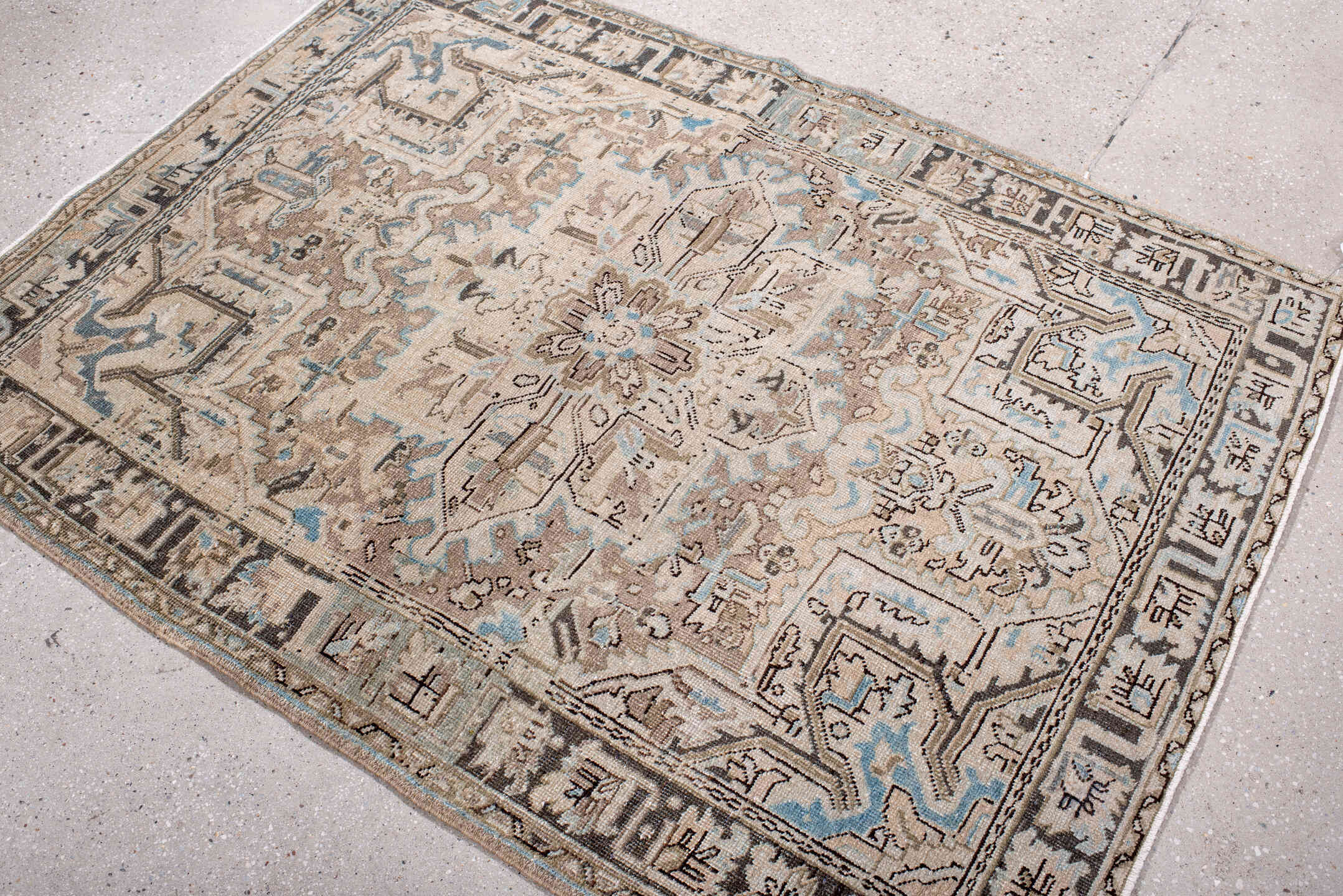 4' x 5' one-of-a-kind handmade antique Heriz small size rug. Color palette: ivory, taupe, camel, charcoal, sky blue, beige
