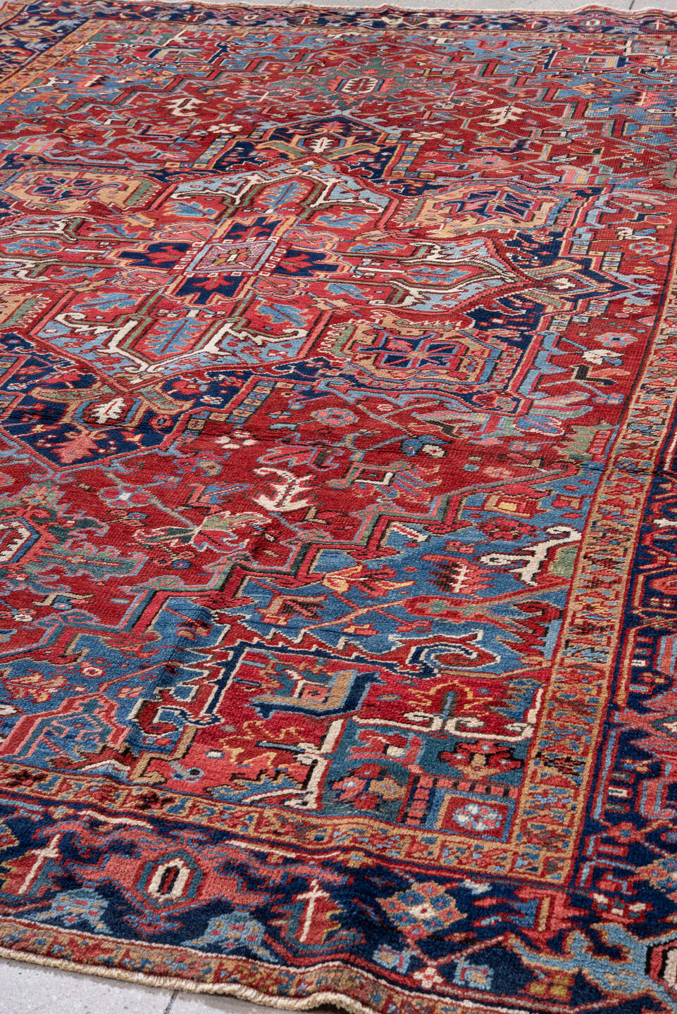 7' x 10' one-of-a-kind handmade vintage Heriz large size rug. Color palette: red, navy, sky blue, ivory, rust, coral, camel