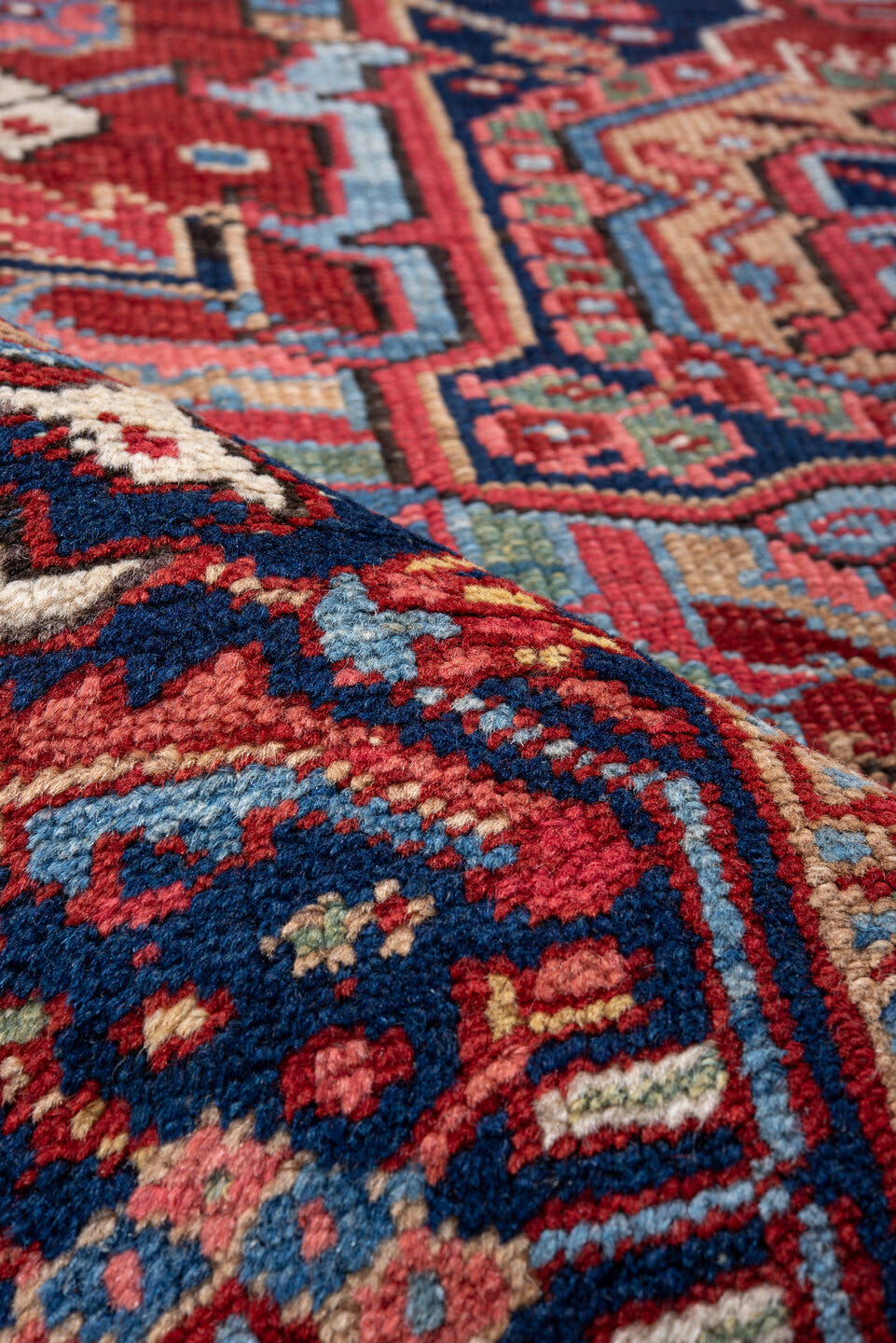 7' x 10' one-of-a-kind handmade vintage Heriz large size rug. Color palette: red, navy, sky blue, ivory, rust, coral, camel