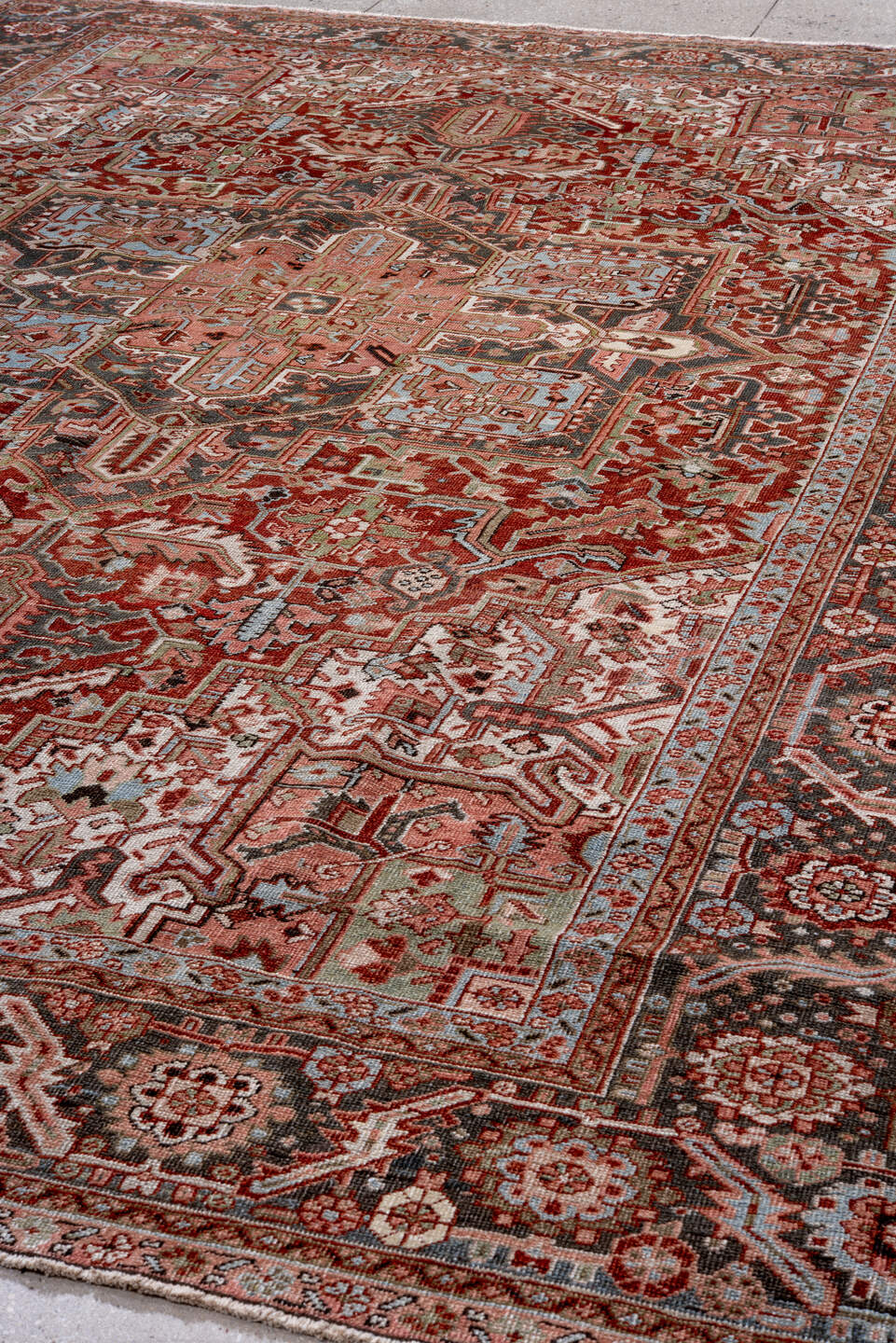 9' x 12' one-of-a-kind handmade vintage Heriz large size rug. Color palette: rust, charcoal, ivory, rose, sky blue, sage