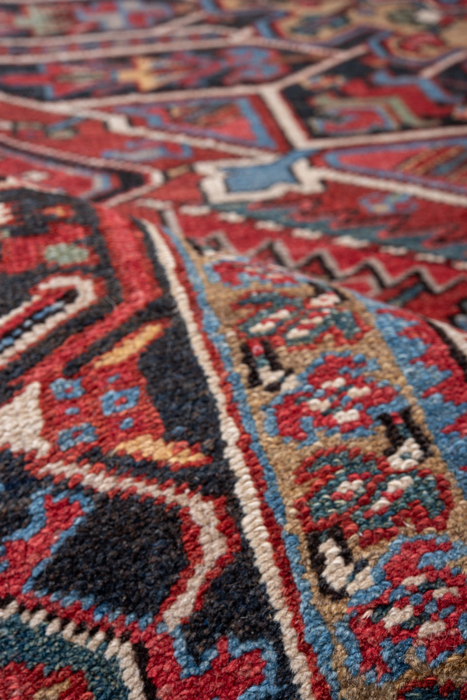 7' x 10' one-of-a-kind handmade vintage Heriz large size rug. Color palette: rust, navy, ivory, sky blue, camel, crimson