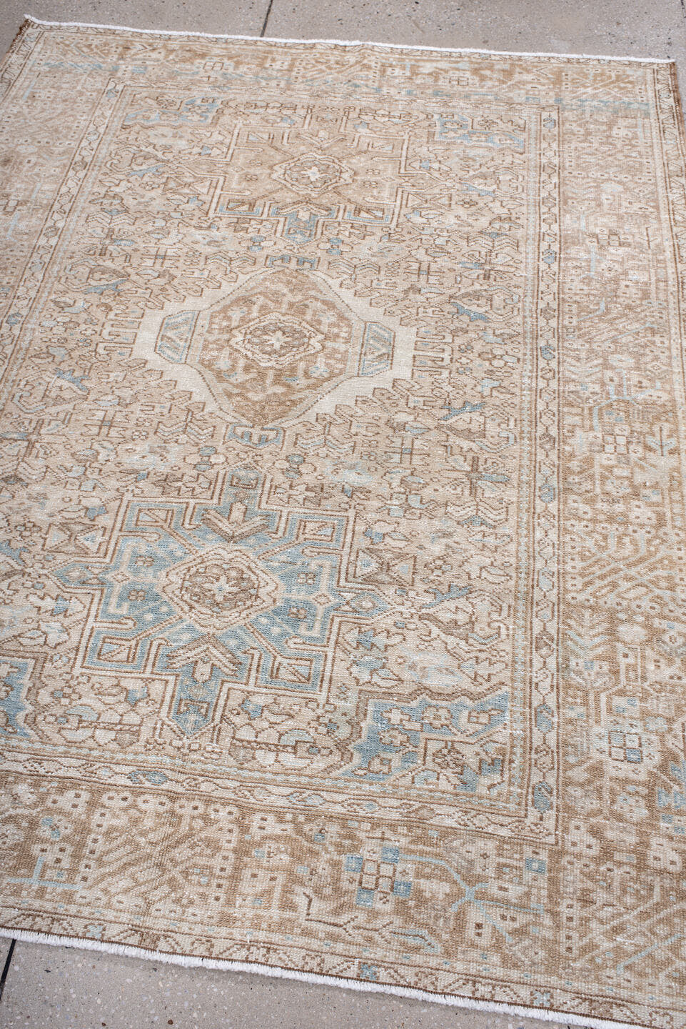 4' x 6' one-of-a-kind handmade antique Karaje rug. Color palette: camel, ivory, sky blue, taupe, beige, light blue, gray