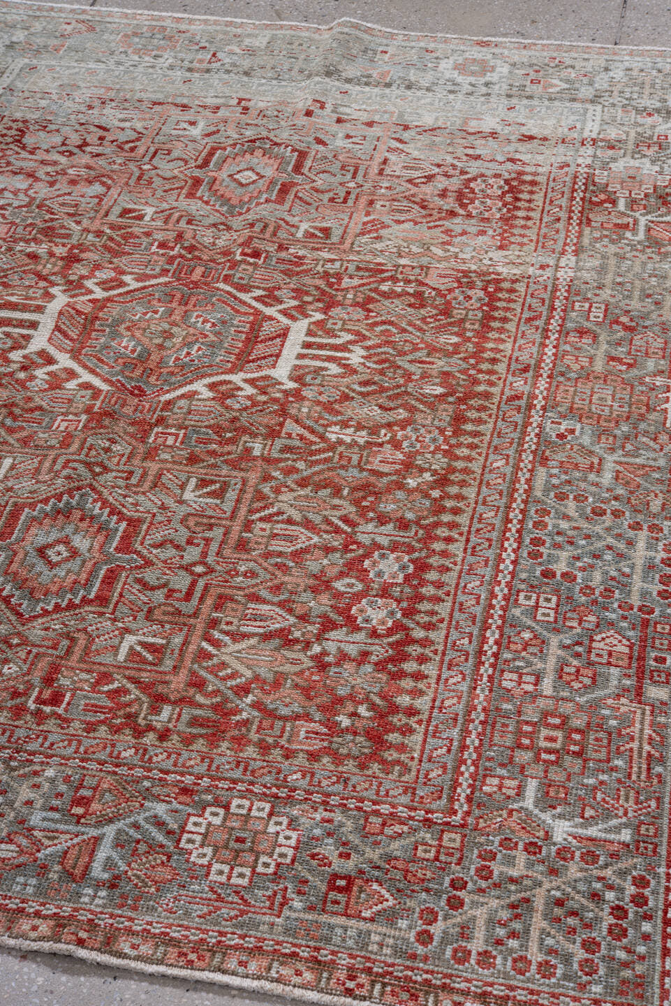 5' x 6' one-of-a-kind handmade vintage Karaje rug. Color palette: gray, rust, ivory, brick, taupe, terracotta, brown, red