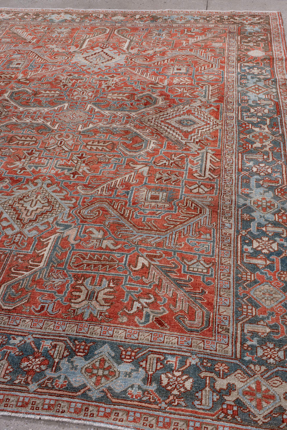 7' x 9' one-of-a-kind handmade antique Heriz rug. Color palette: rust, powder_blue, ivory, brown, slate, terracotta