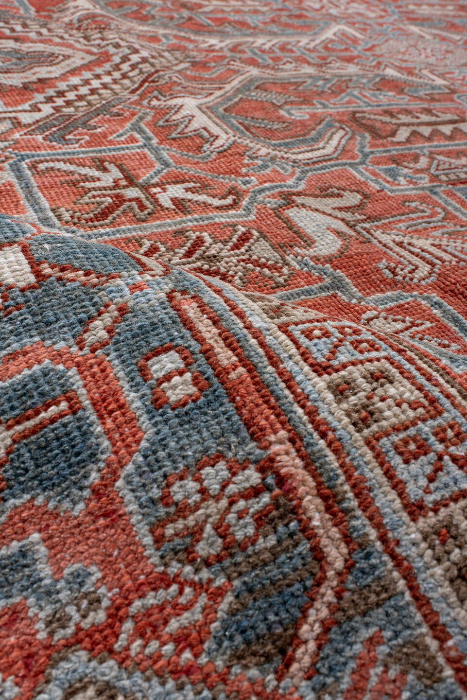 7' x 9' one-of-a-kind handmade antique Heriz rug. Color palette: rust, powder_blue, ivory, brown, slate, terracotta