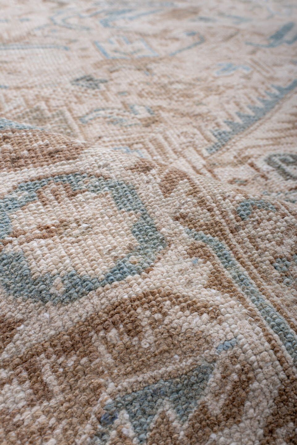 7' x 8' one-of-a-kind handmade antique Heriz rug. Color palette: ivory, camel, pale blue, taupe, beige, light brown