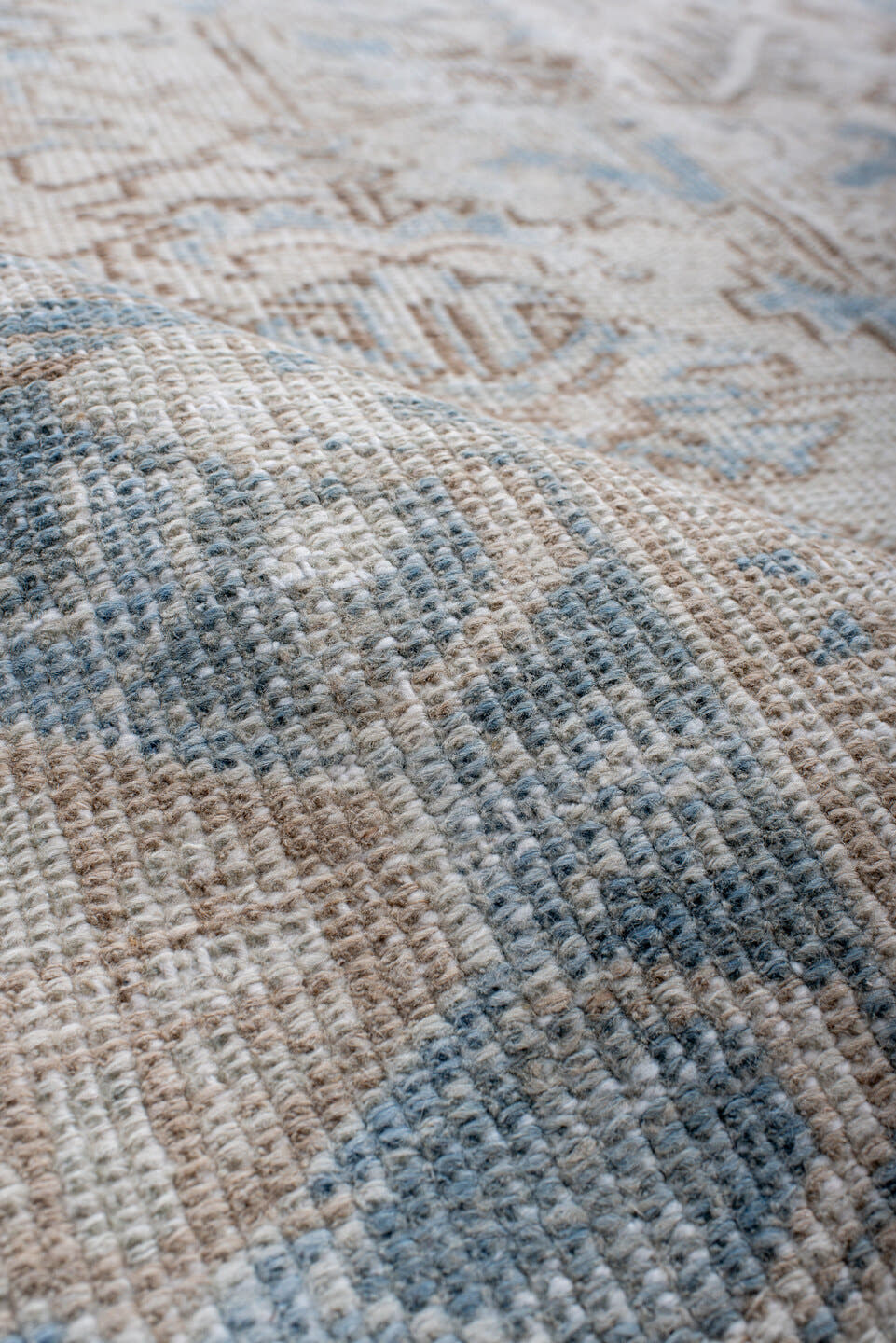 7' x 10' one-of-a-kind handmade antique Heriz large size rug. Color palette: ivory, sky blue, taupe, beige, camel
