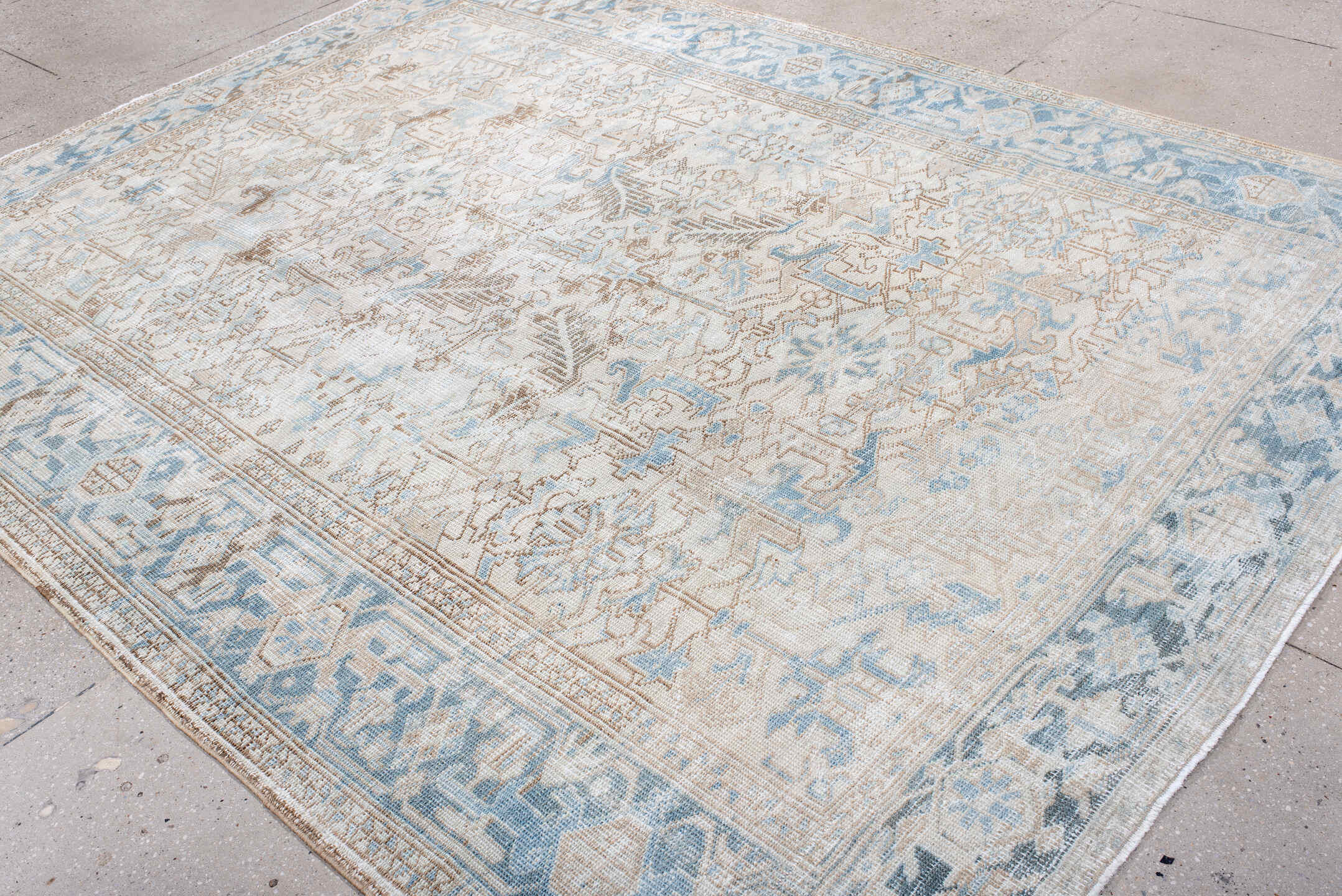 7' x 10' one-of-a-kind handmade antique Heriz large size rug. Color palette: ivory, sky blue, taupe, beige, camel
