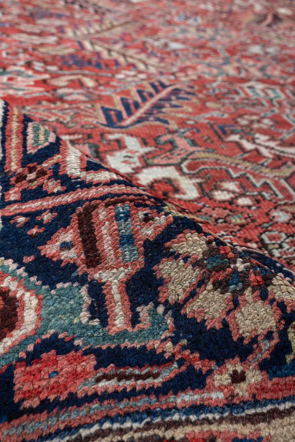 7' x 9' one-of-a-kind handmade vintage Heriz rug. Color palette: terracotta, navy, ivory, sky blue, slate blue, coral, camel