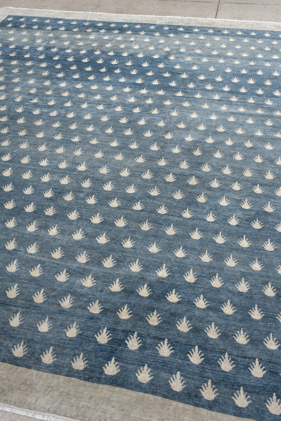 7' x 9' one-of-a-kind handmade vintage Tibetan rug. Color palette: blue, ivory, cream, taupe, gray, beige