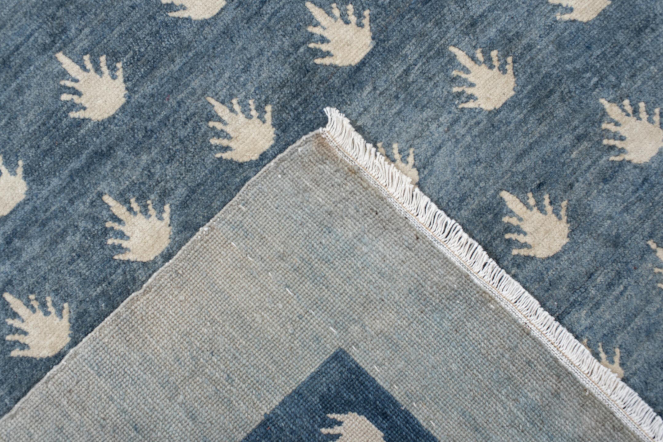 7' x 9' one-of-a-kind handmade vintage Tibetan rug. Color palette: blue, ivory, cream, taupe, gray, beige