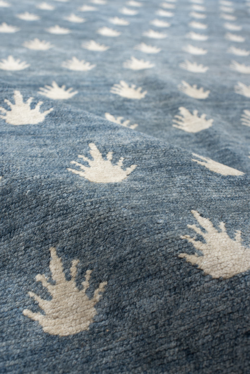 7' x 9' one-of-a-kind handmade vintage Tibetan rug. Color palette: blue, ivory, cream, taupe, gray, beige