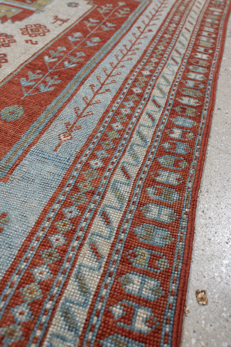 4' x 3' one-of-a-kind handmade antique Caucasian rug. Color palette: terracotta, sky blue, ivory, sage, rust, brown