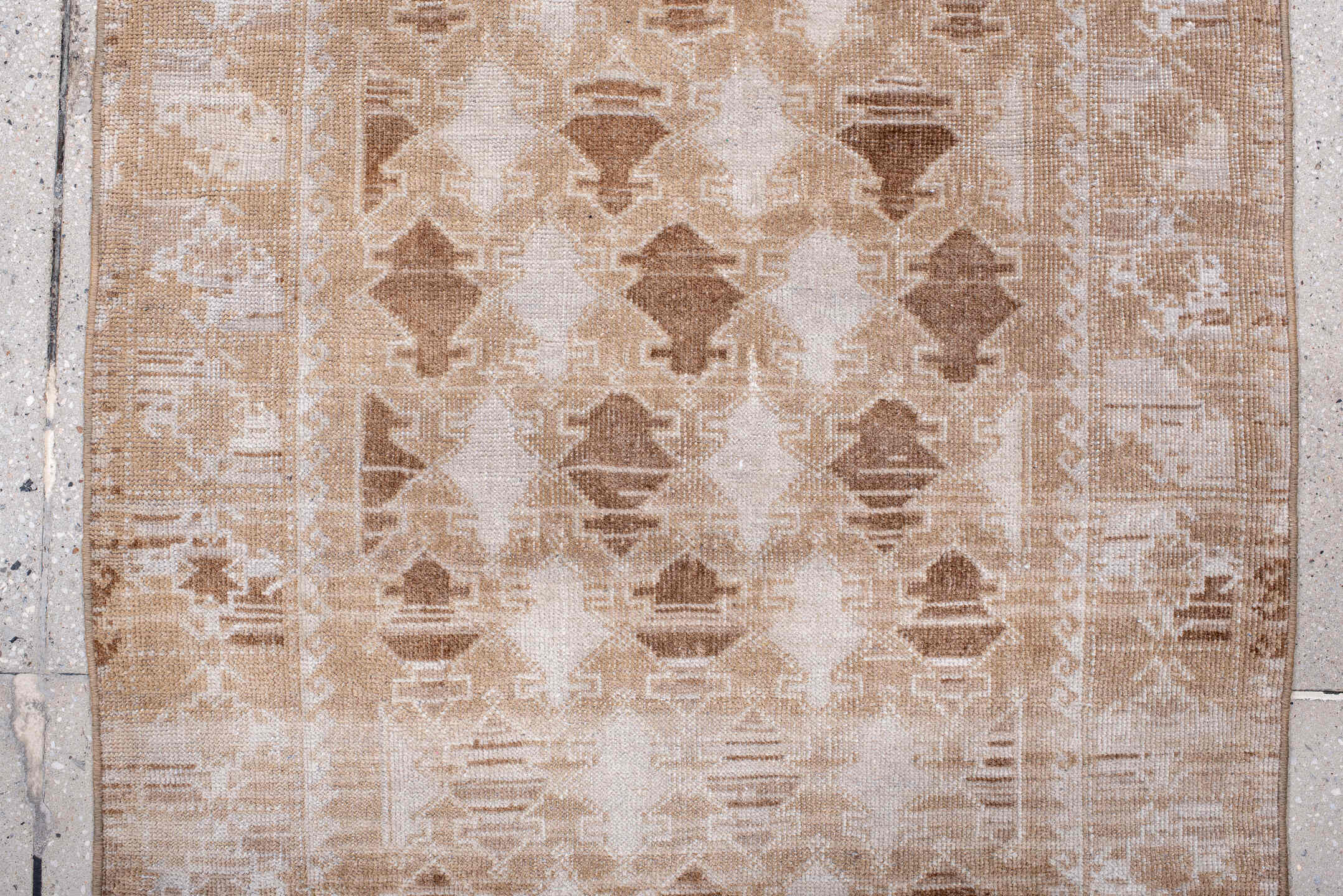 2' x 4' one-of-a-kind handmade antique Belouch small size rug. Color palette: ivory, camel, taupe, beige, gray