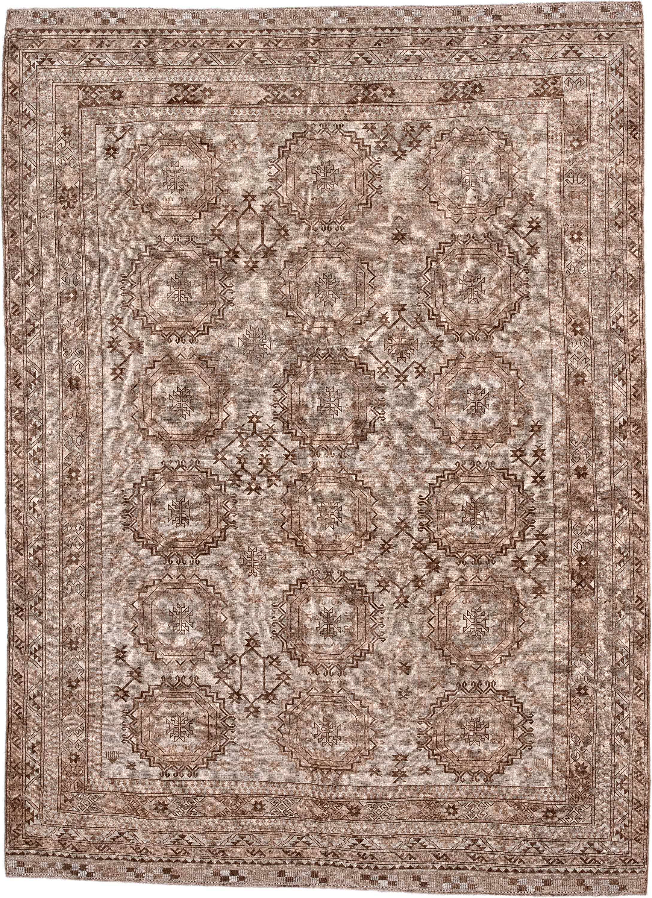 7' x 10' one-of-a-kind handmade antique Afghan large size rug. Color palette: taupe, camel, ivory, brown, beige, gray