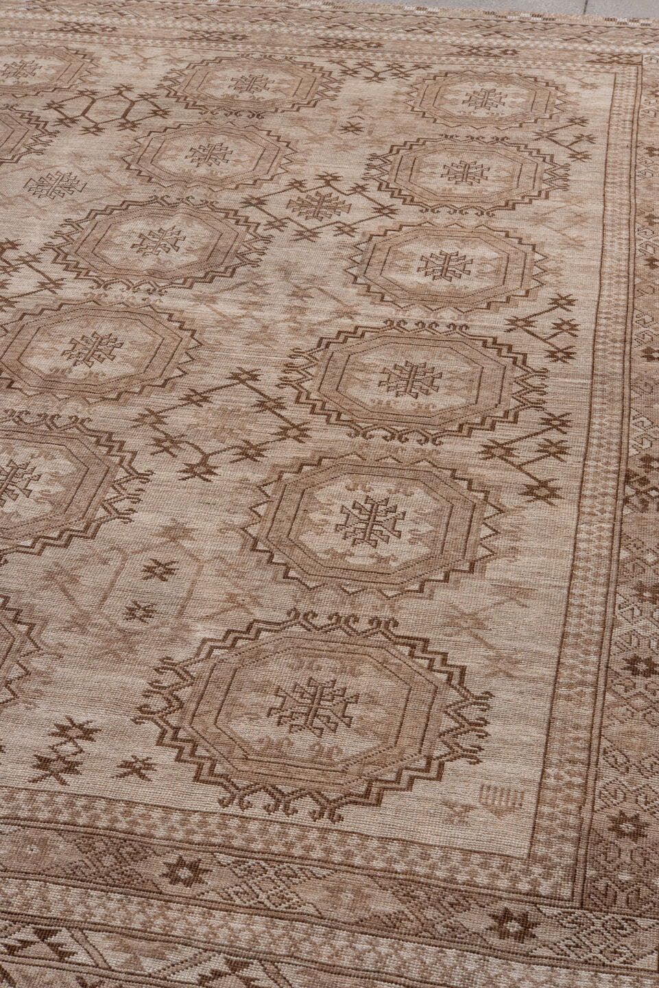 7' x 10' one-of-a-kind handmade antique Afghan large size rug. Color palette: taupe, camel, ivory, brown, beige, gray