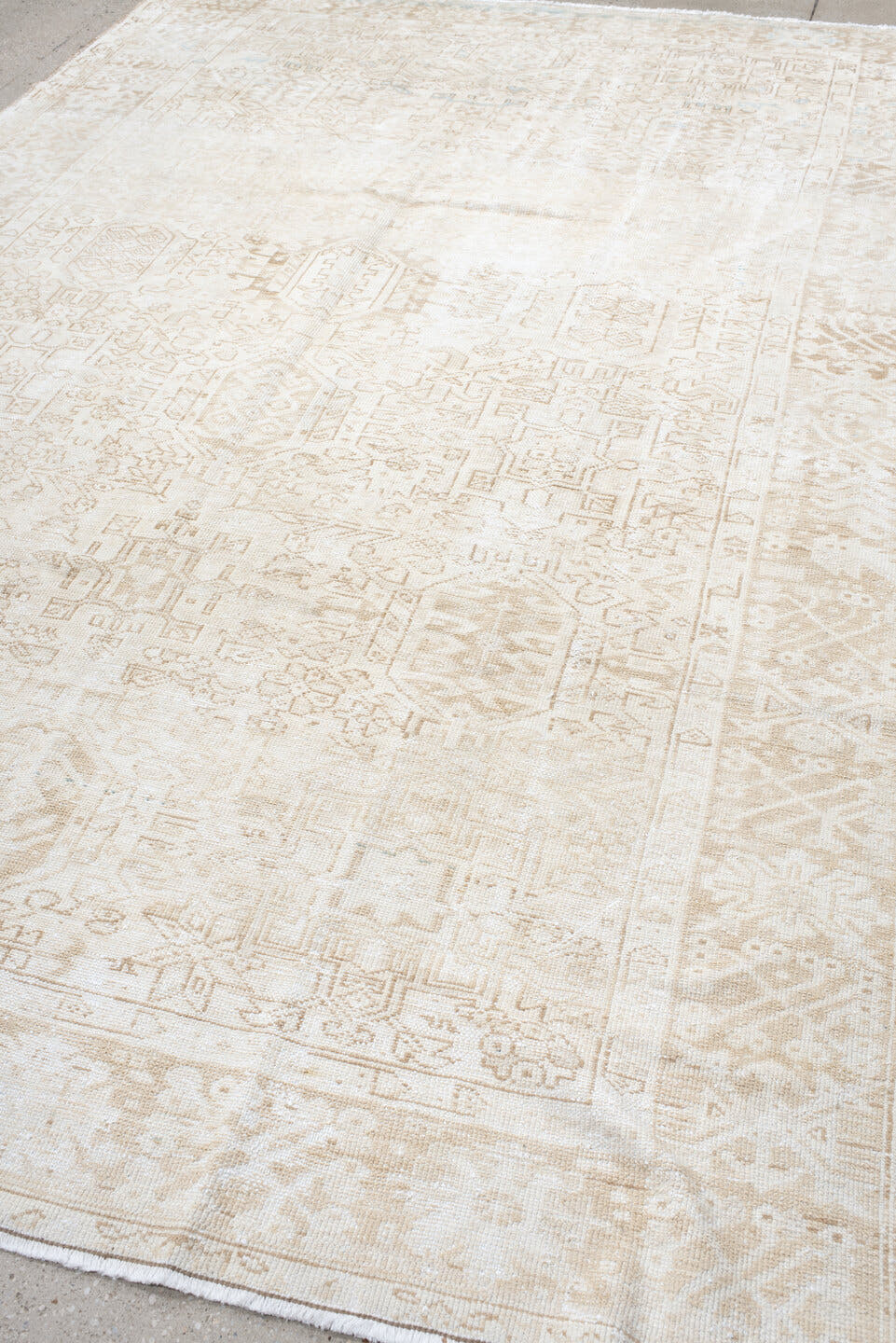 7' x 10' one-of-a-kind handmade antique Heriz large size rug. Color palette: ivory, cream, beige, sand, pale blue, taupe