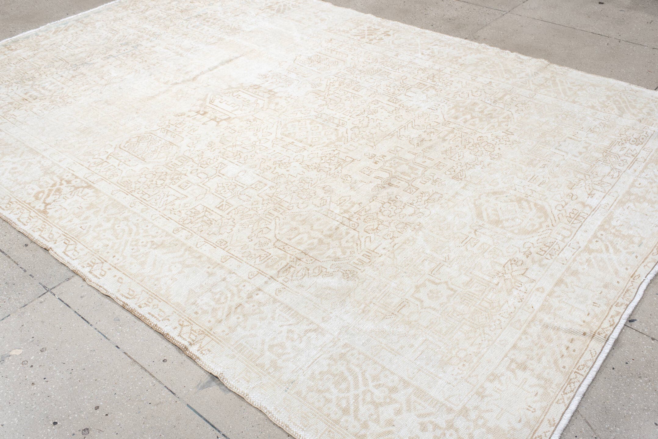 7' x 10' one-of-a-kind handmade antique Heriz large size rug. Color palette: ivory, cream, beige, sand, pale blue, taupe
