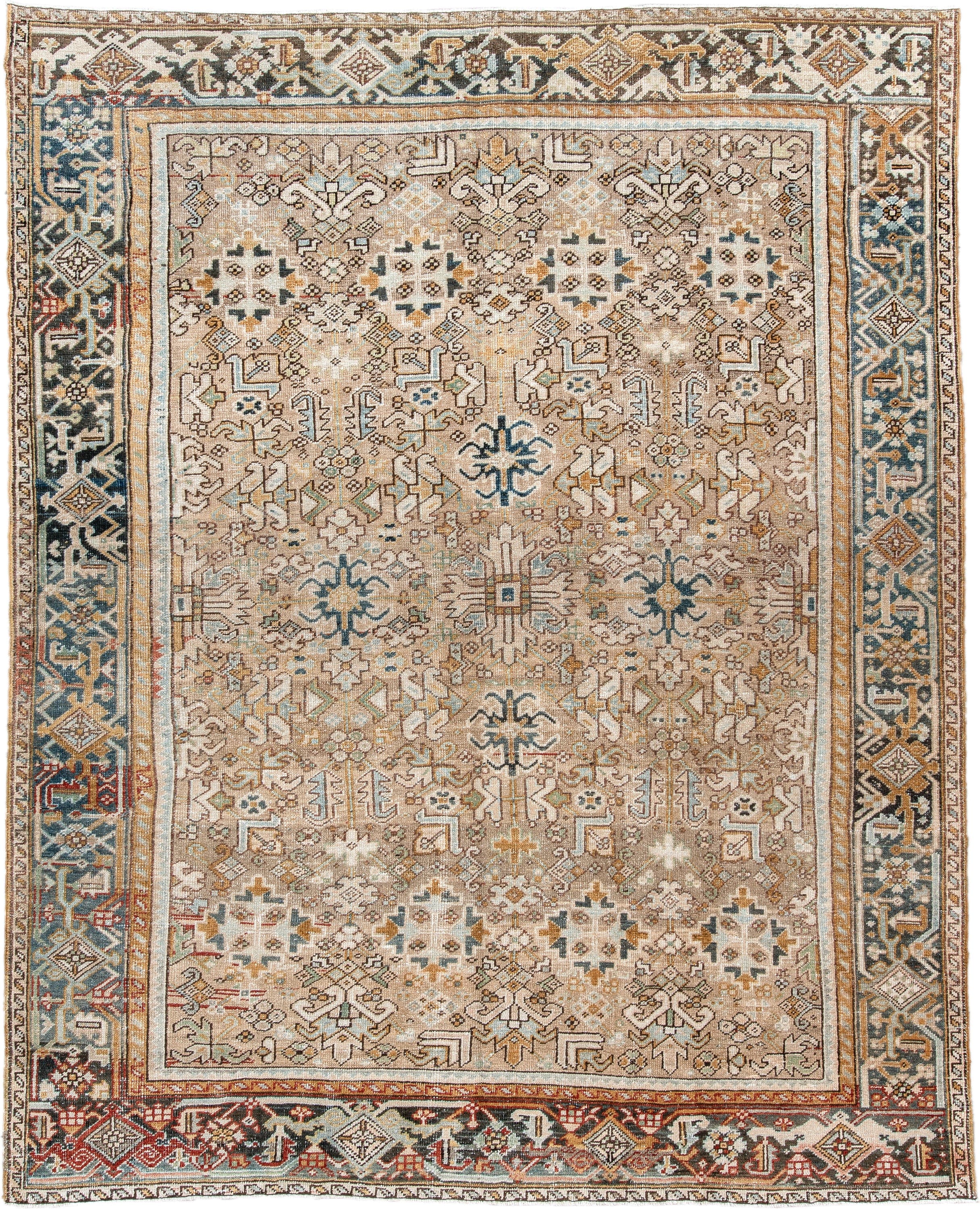 7' x 9' one-of-a-kind handmade antique Heriz rug. Color palette: taupe, ivory, faded indigo, camel, rust, charcoal, beige