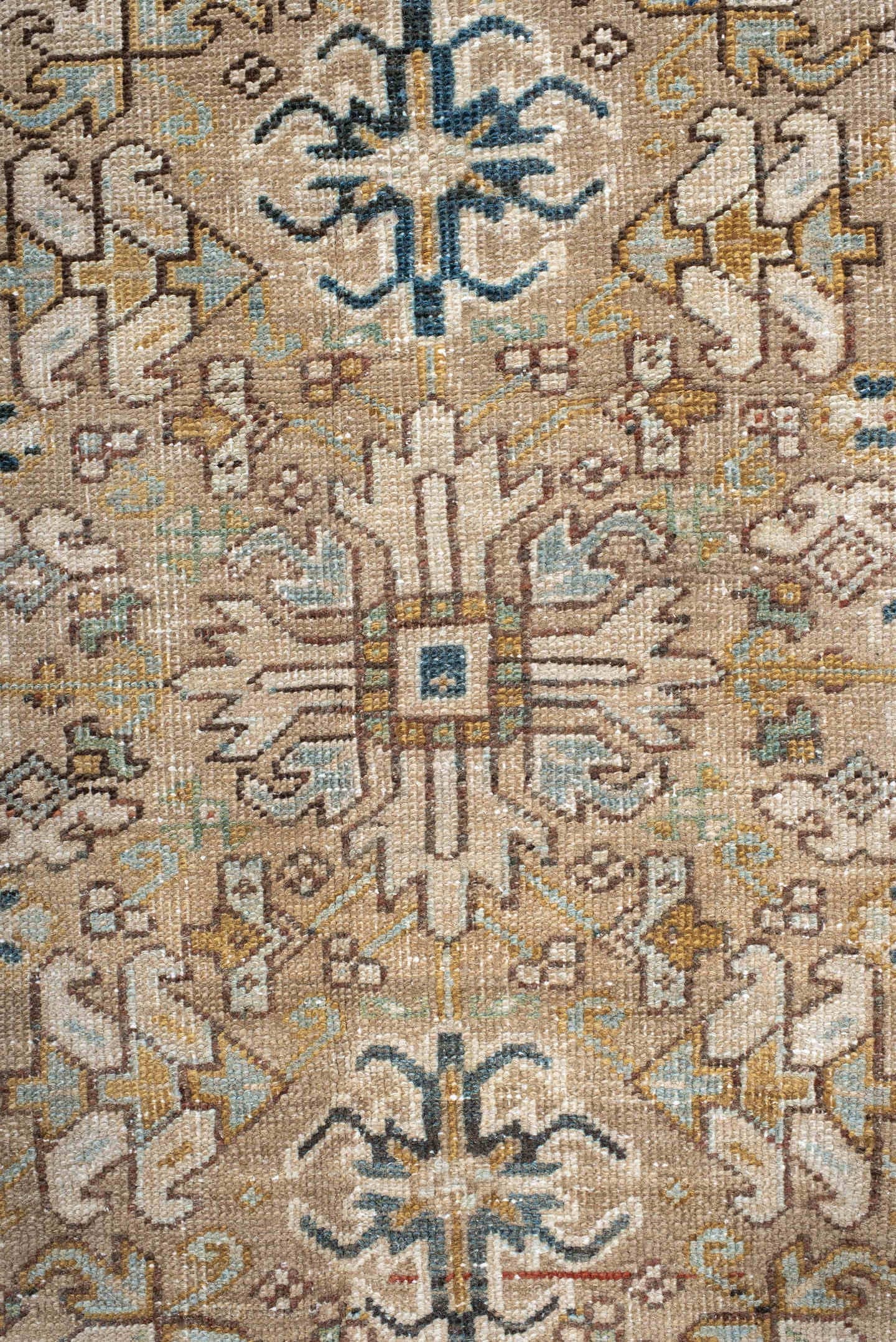 7' x 9' one-of-a-kind handmade antique Heriz rug. Color palette: taupe, ivory, faded indigo, camel, rust, charcoal, beige