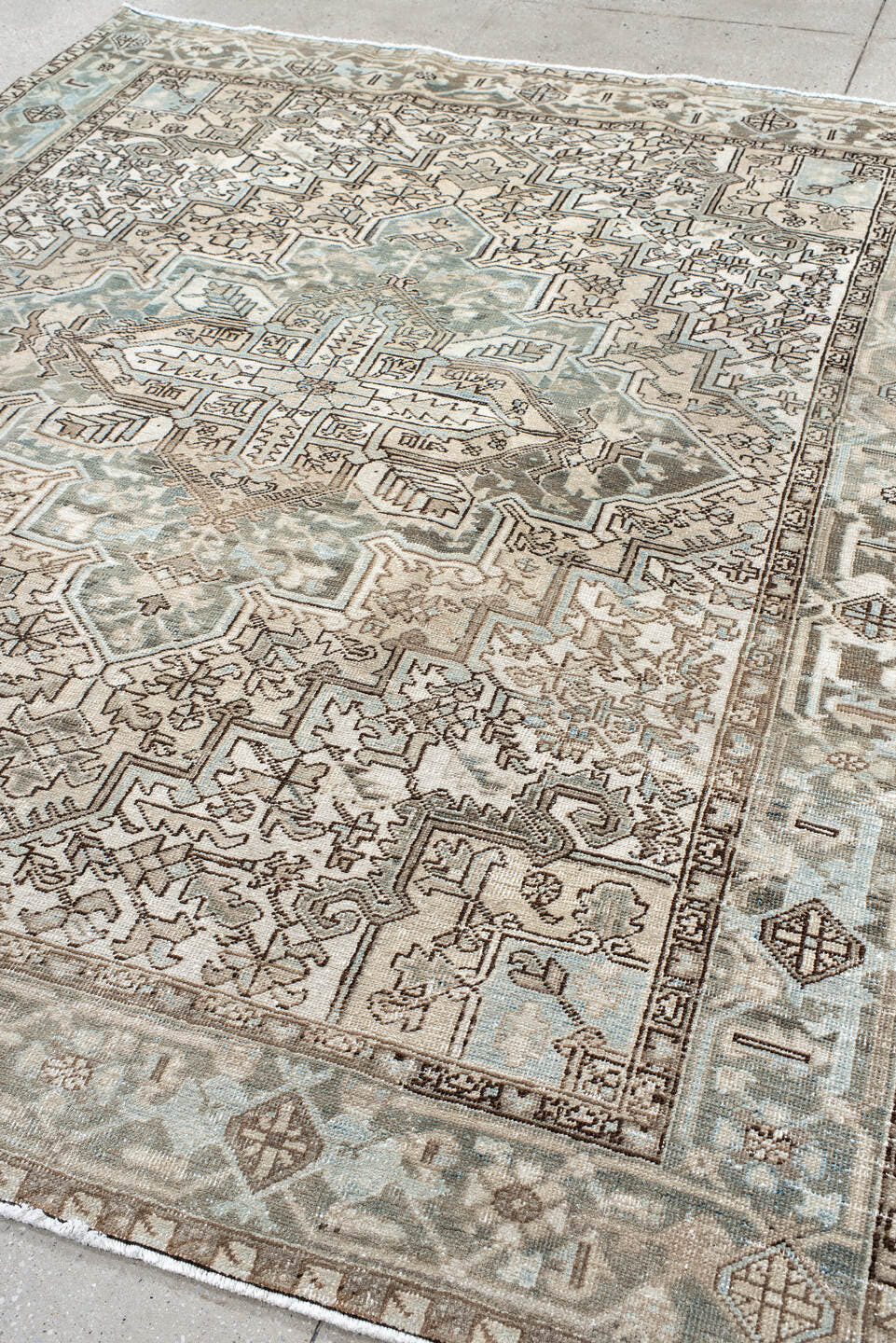 7' x 8' one-of-a-kind handmade antique Heriz rug. Color palette: ivory, pale blue, taupe, brown, beige, camel, slate