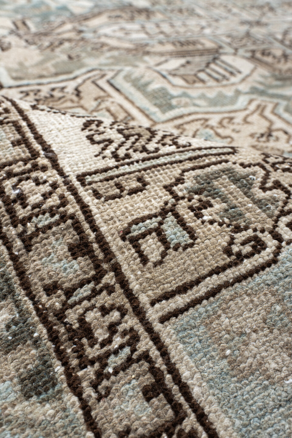 7' x 8' one-of-a-kind handmade antique Heriz rug. Color palette: ivory, pale blue, taupe, brown, beige, camel, slate