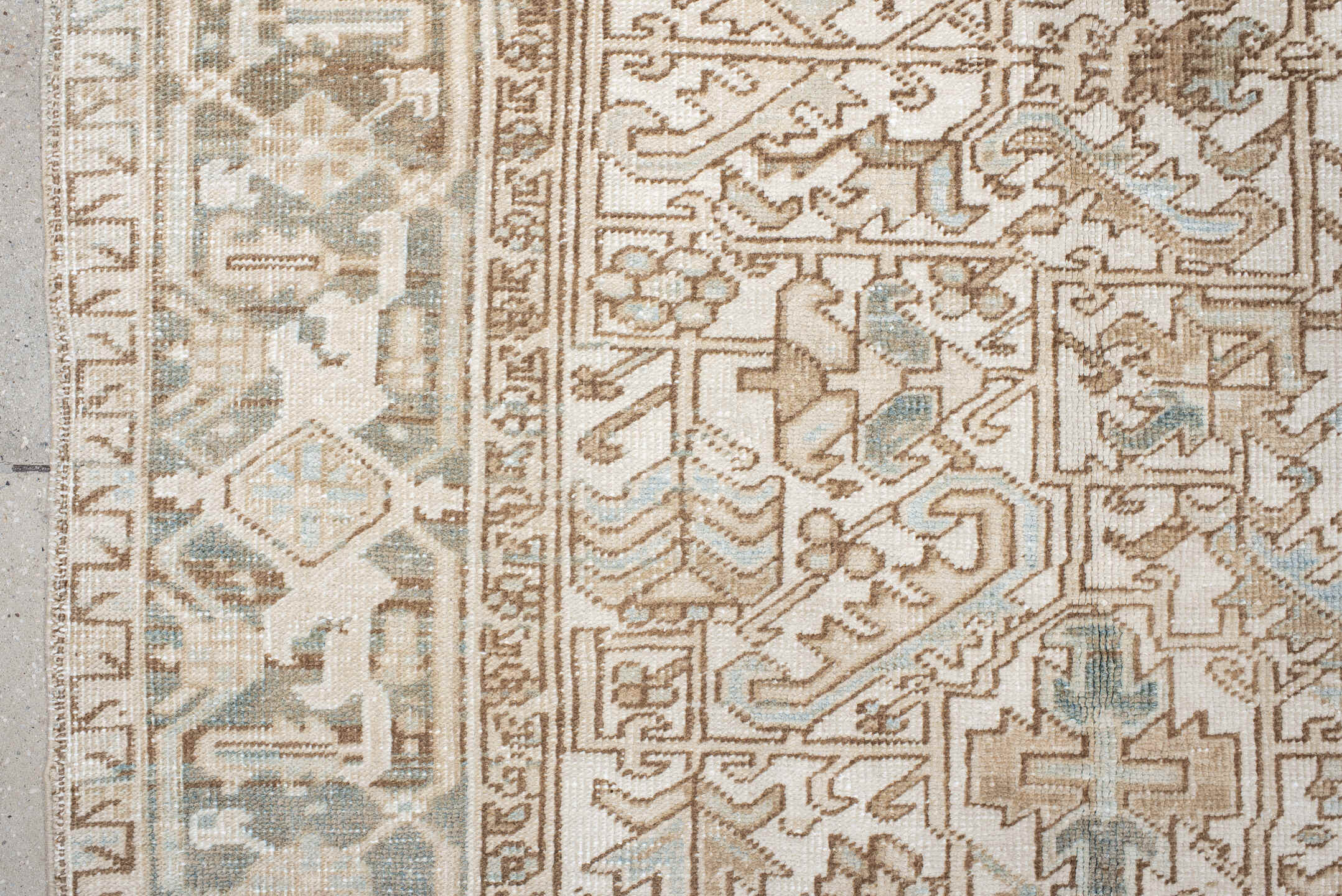7' x 9' one-of-a-kind handmade antique Heriz rug. Color palette: ivory, camel, pale blue, taupe, beige, light gray