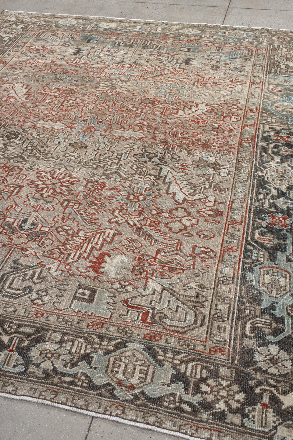 7' x 8' one-of-a-kind handmade vintage Heriz rug. Color palette: black, brown, gray, light gray, off-white, pink, red