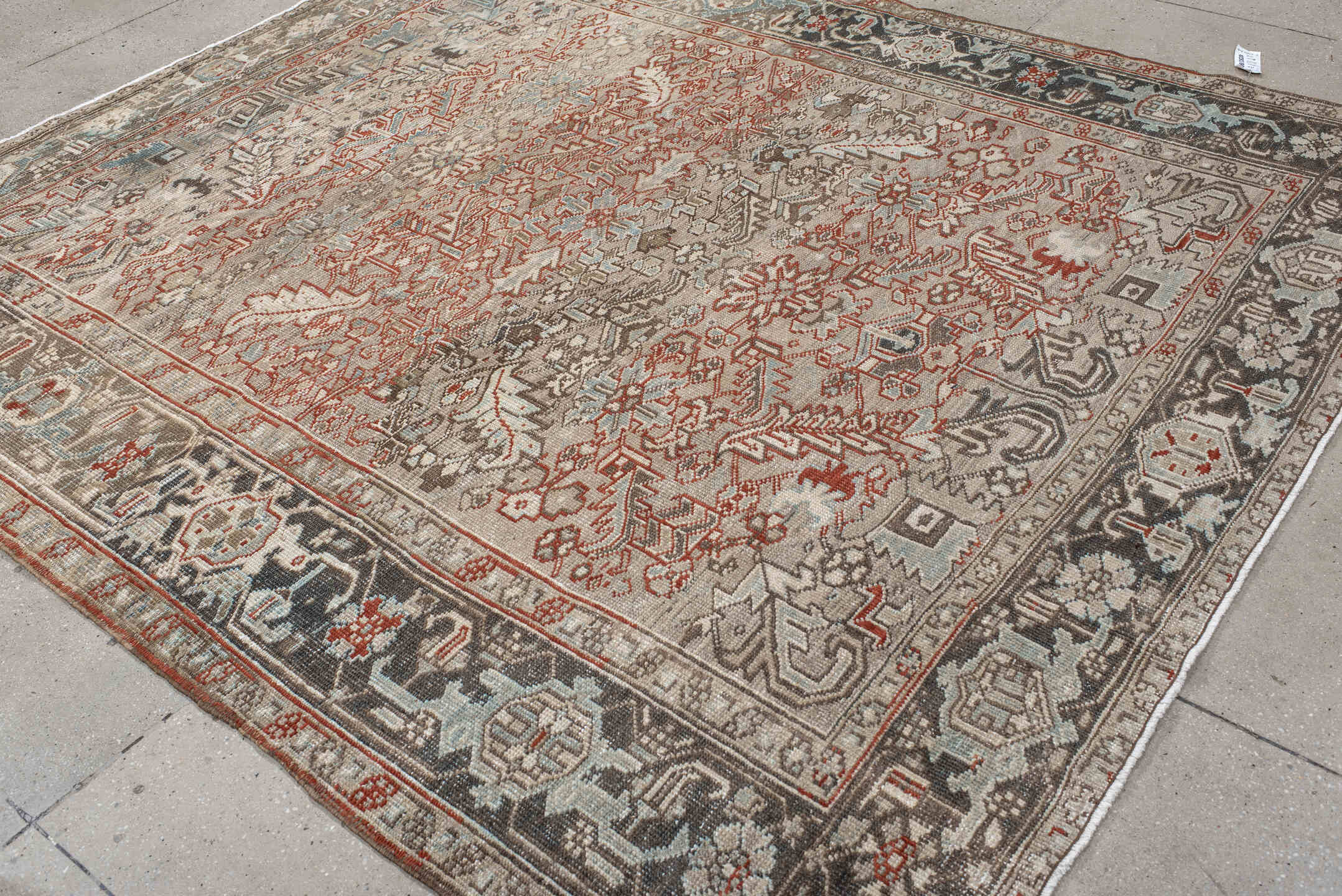 7' x 8' one-of-a-kind handmade vintage Heriz rug. Color palette: black, brown, gray, light gray, off-white, pink, red