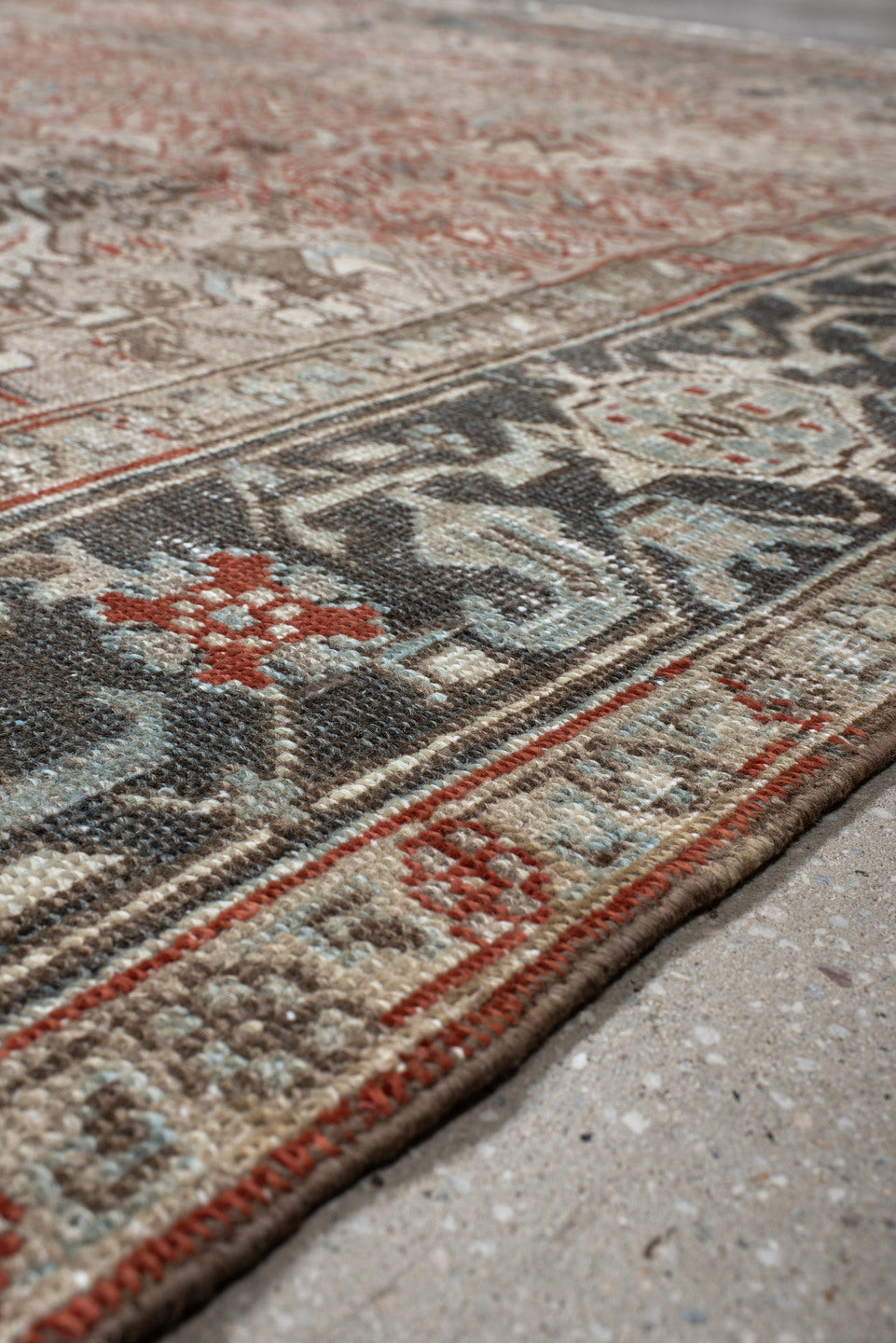 7' x 8' one-of-a-kind handmade vintage Heriz rug. Color palette: black, brown, gray, light gray, off-white, pink, red