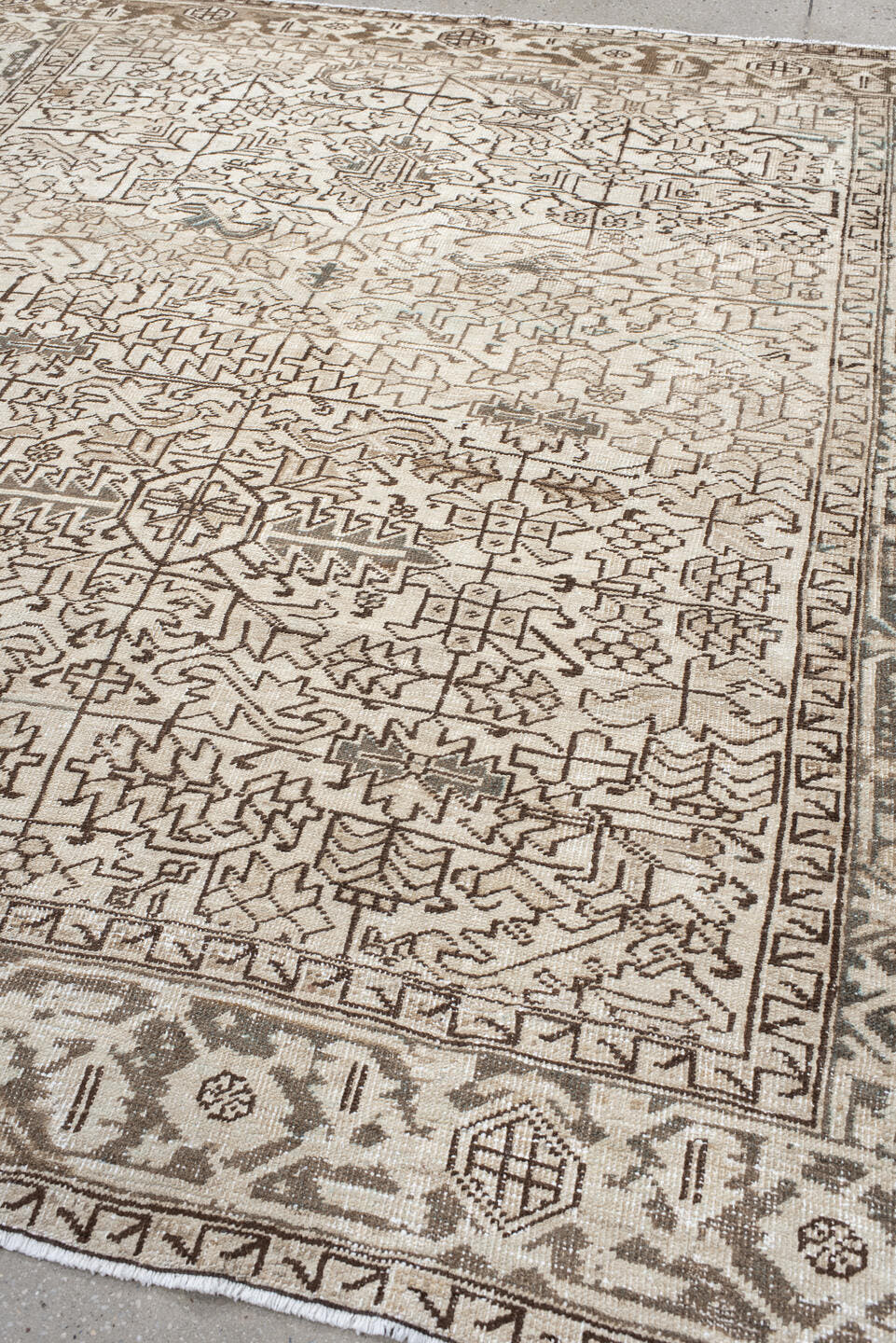 7' x 8' one-of-a-kind handmade antique Heriz rug. Color palette: ivory, taupe, brown, charcoal, beige, gray, black