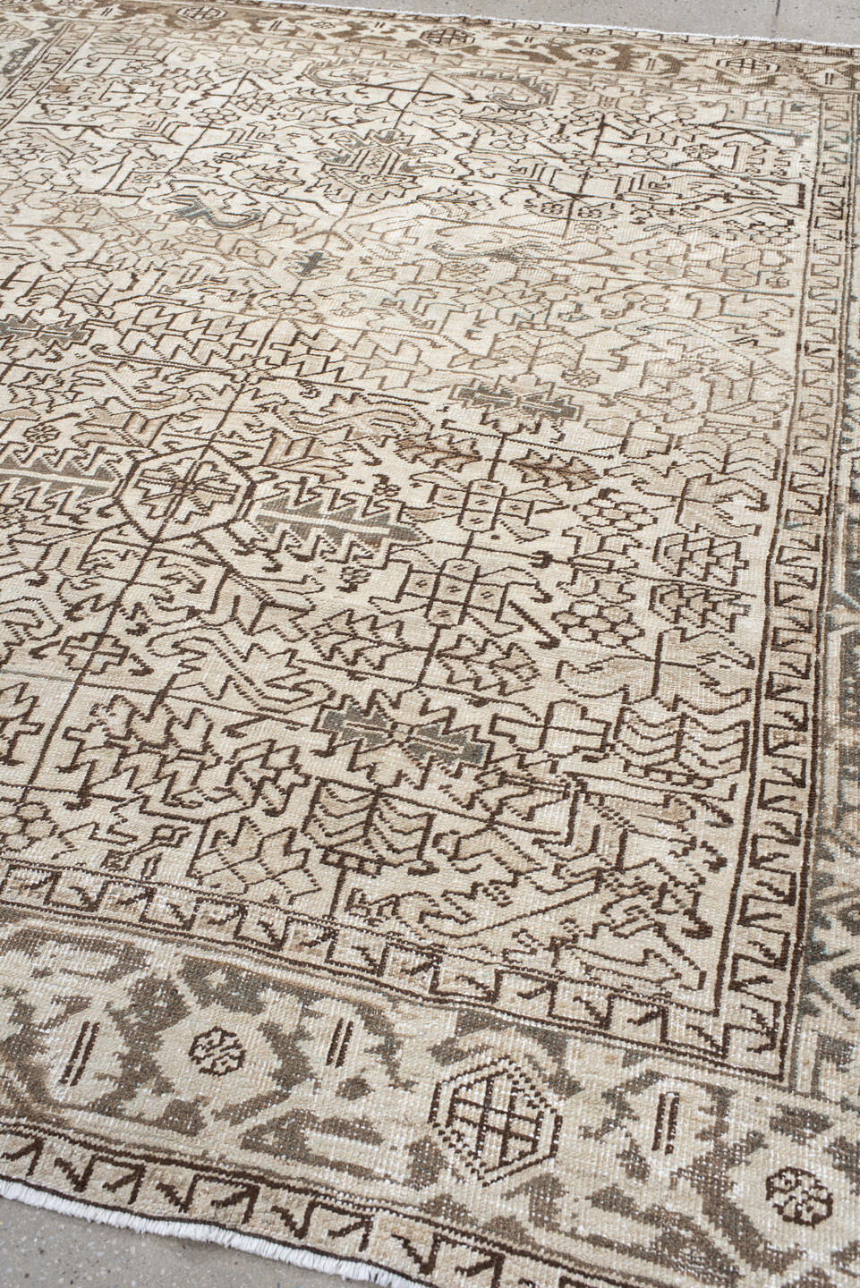 7' x 8' one-of-a-kind handmade antique Heriz rug. Color palette: ivory, taupe, brown, charcoal, beige, gray, black