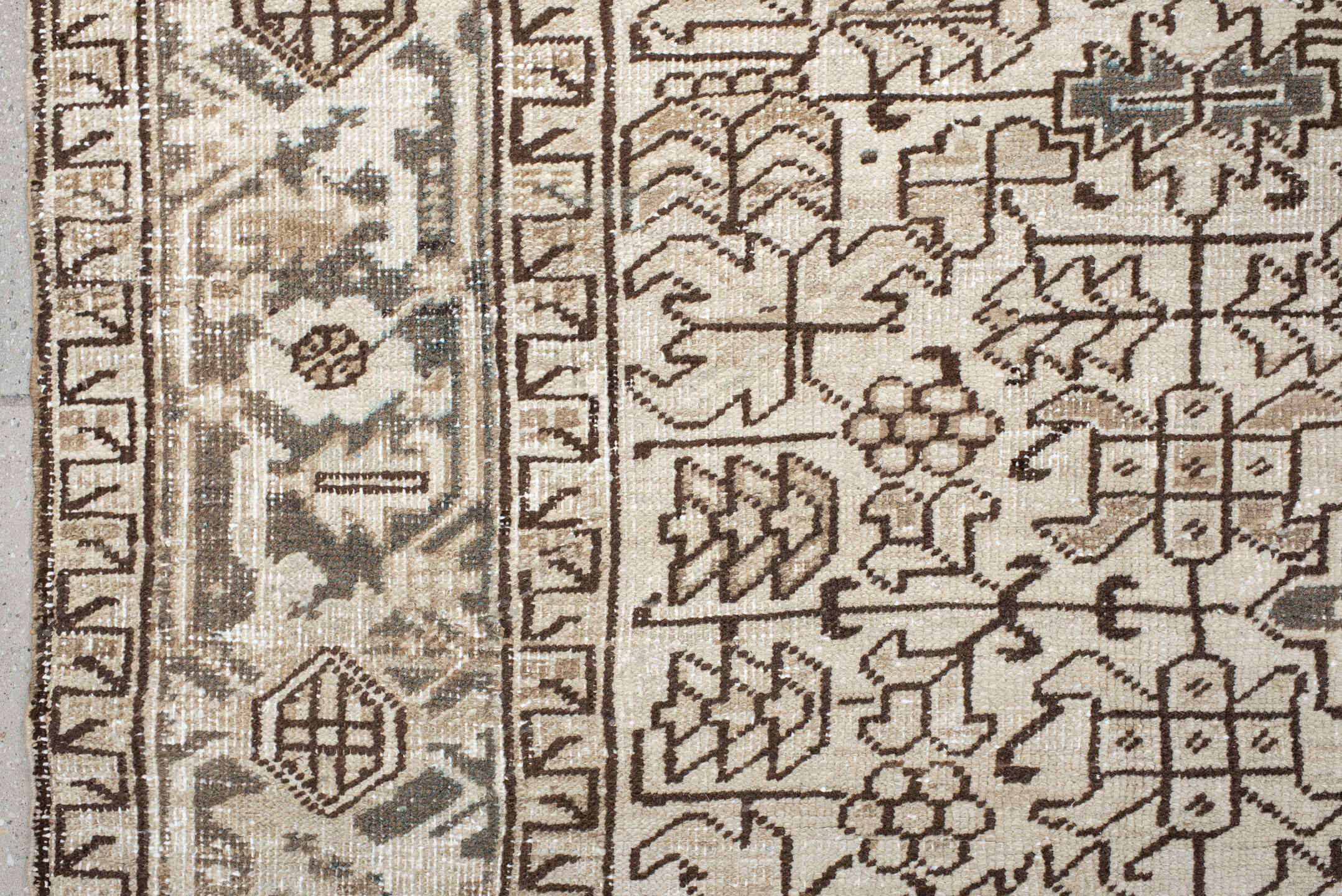 7' x 8' one-of-a-kind handmade antique Heriz rug. Color palette: ivory, taupe, brown, charcoal, beige, gray, black