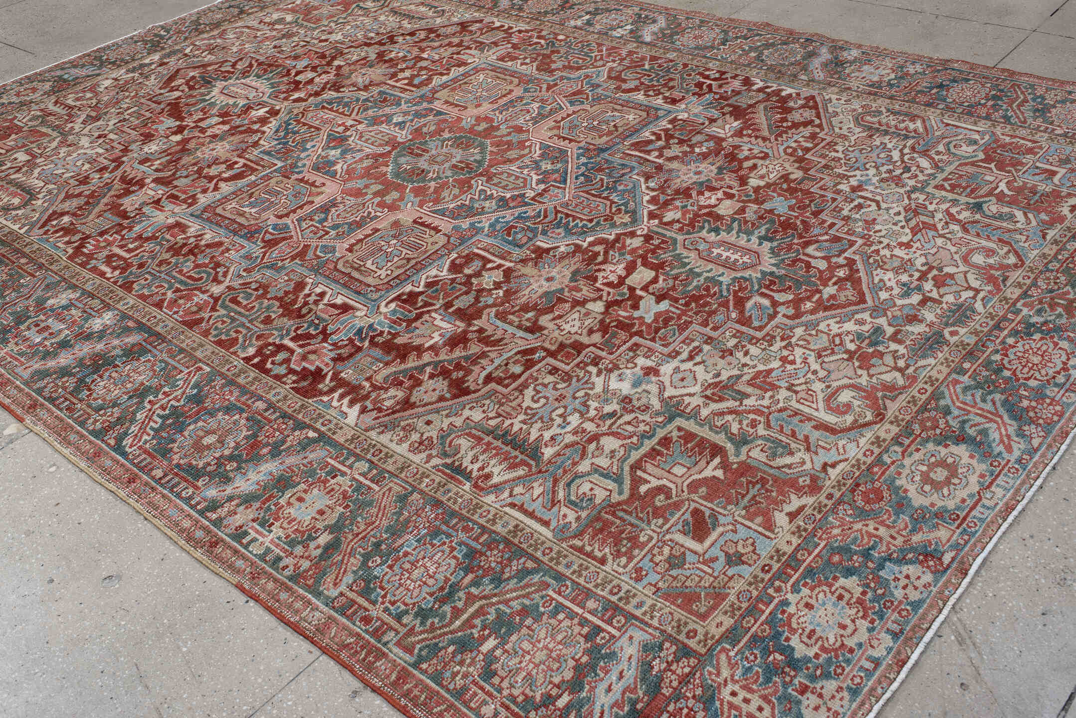 8' x 12' one-of-a-kind handmade antique Heriz large size rug. Color palette: rust, ivory, sky blue, slate, brick, cream