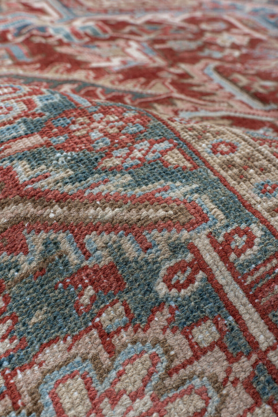 8' x 12' one-of-a-kind handmade antique Heriz large size rug. Color palette: rust, ivory, sky blue, slate, brick, cream