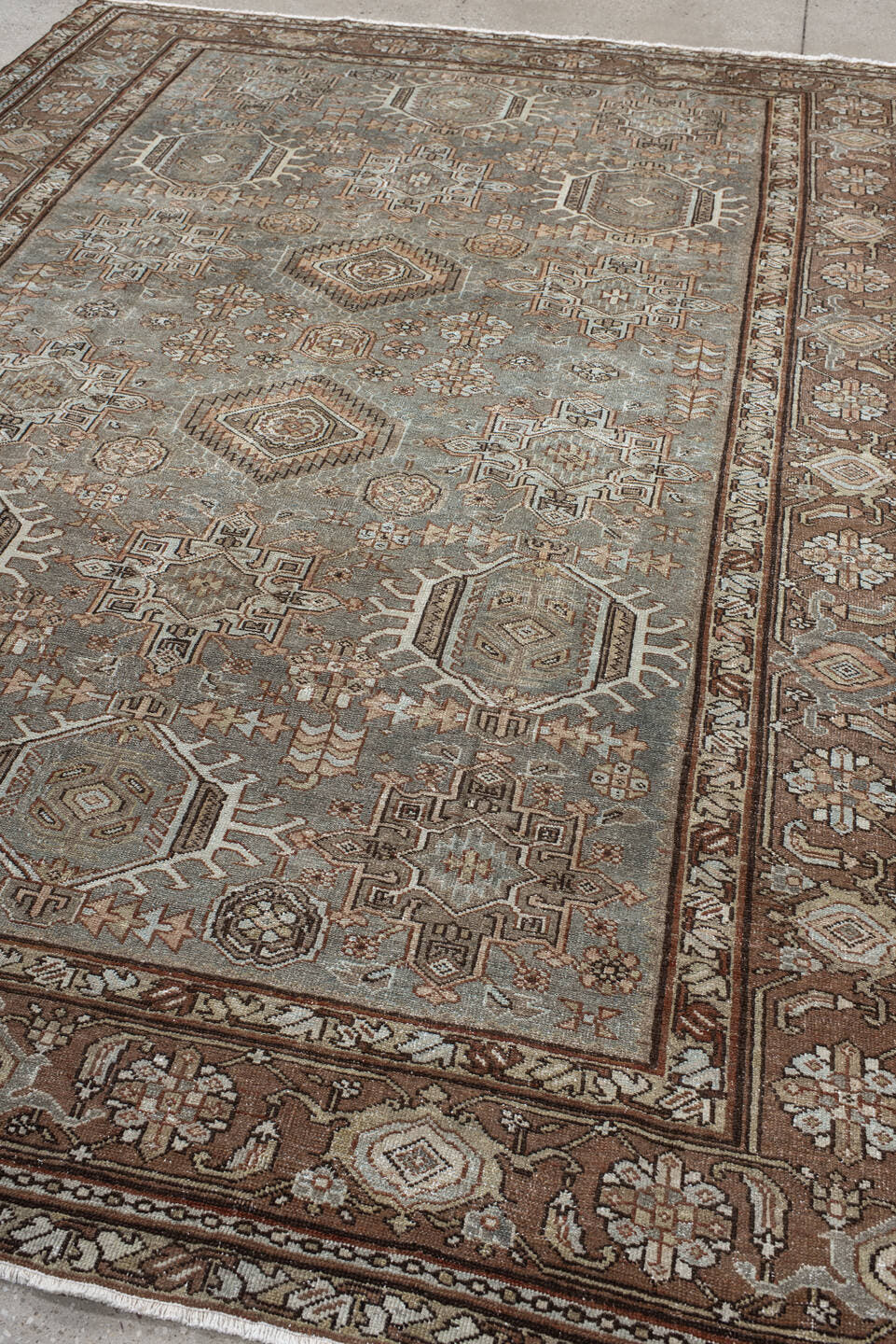 7' x 10' one-of-a-kind handmade vintage Karaje large size rug. Color palette: taupe, brown, ivory, camel, slate, rust, beige