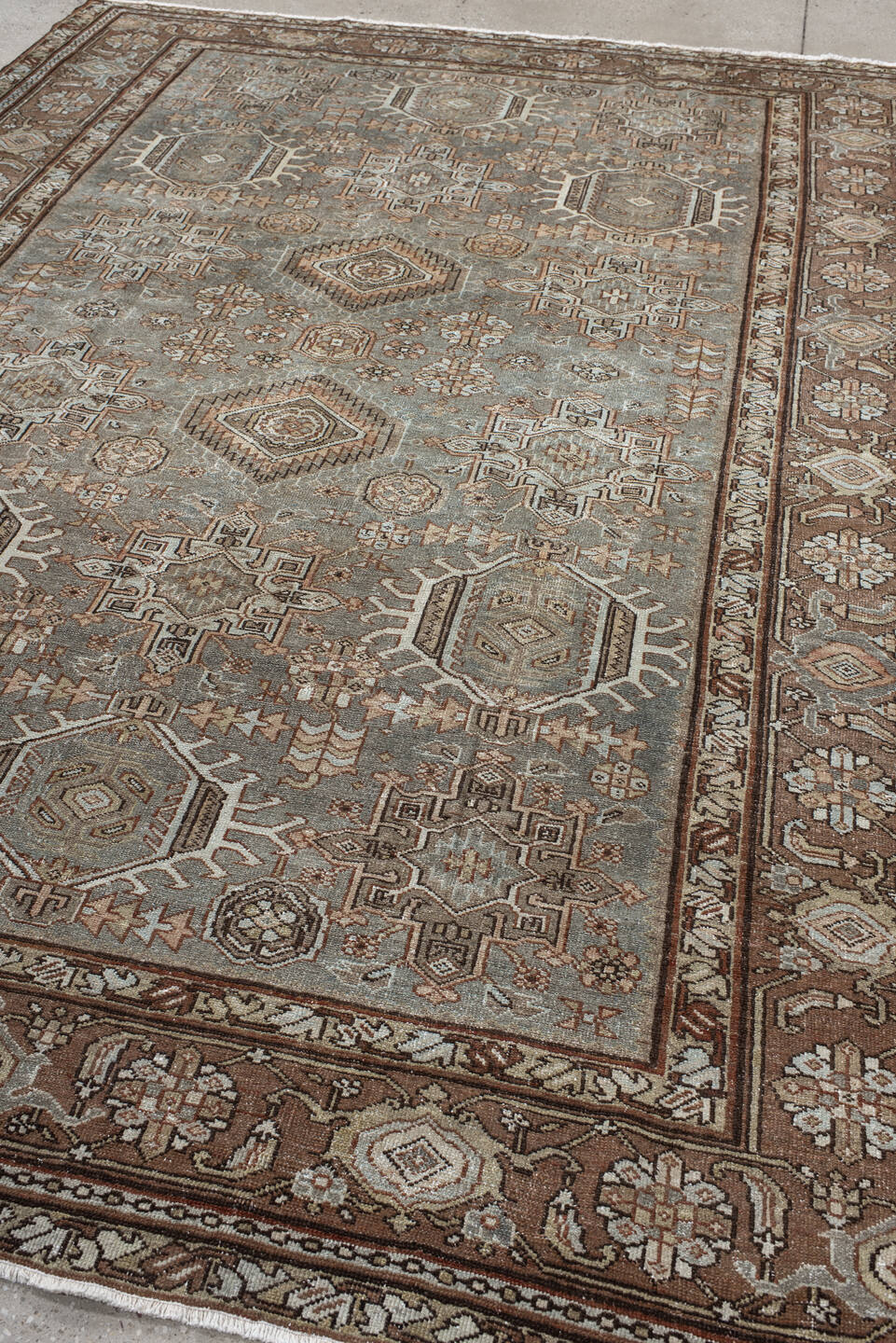 7' x 10' one-of-a-kind handmade vintage Karaje large size rug. Color palette: taupe, brown, ivory, camel, slate, rust, beige