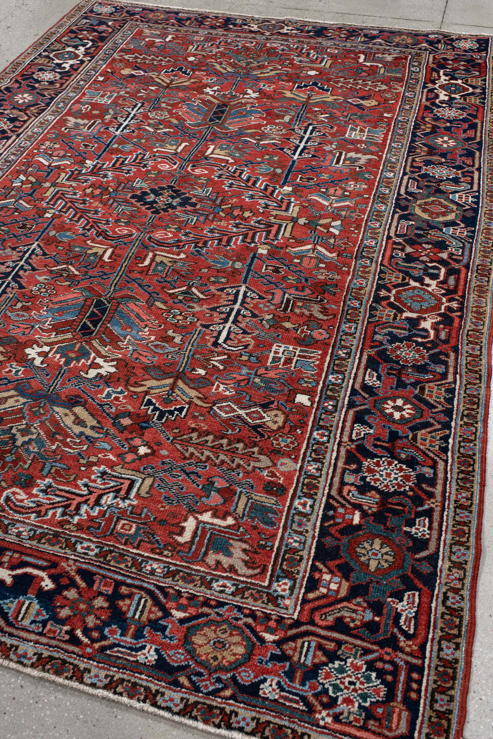 6' x 9' one-of-a-kind handmade antique Heriz medium size rug. Color palette: rust, navy, ivory, sky blue, coral, slate