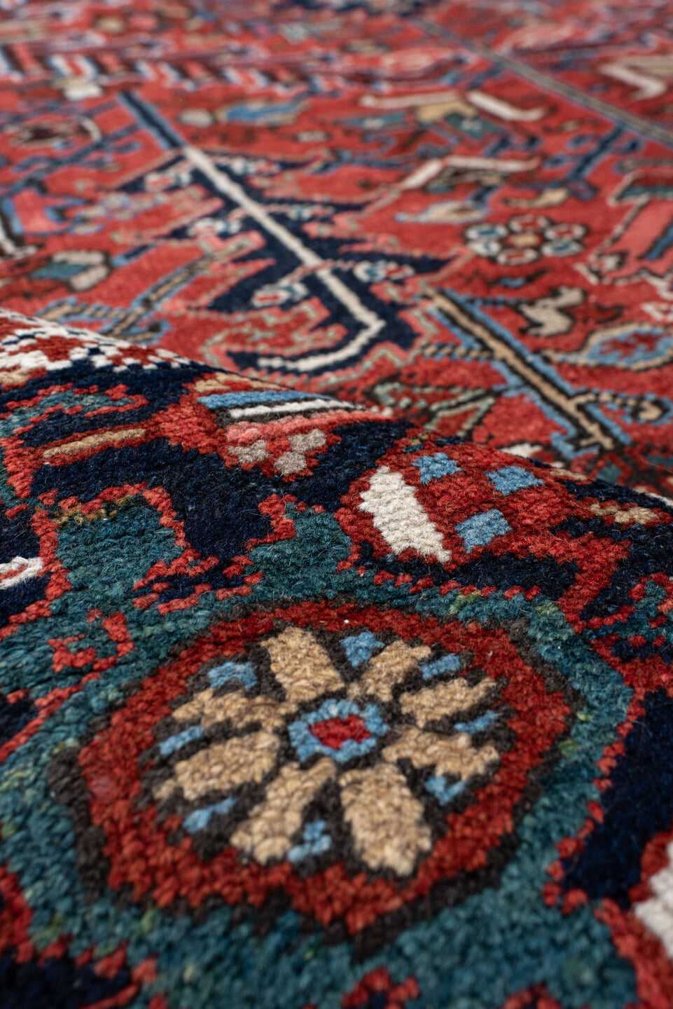 6' x 9' one-of-a-kind handmade antique Heriz medium size rug. Color palette: rust, navy, ivory, sky blue, coral, slate