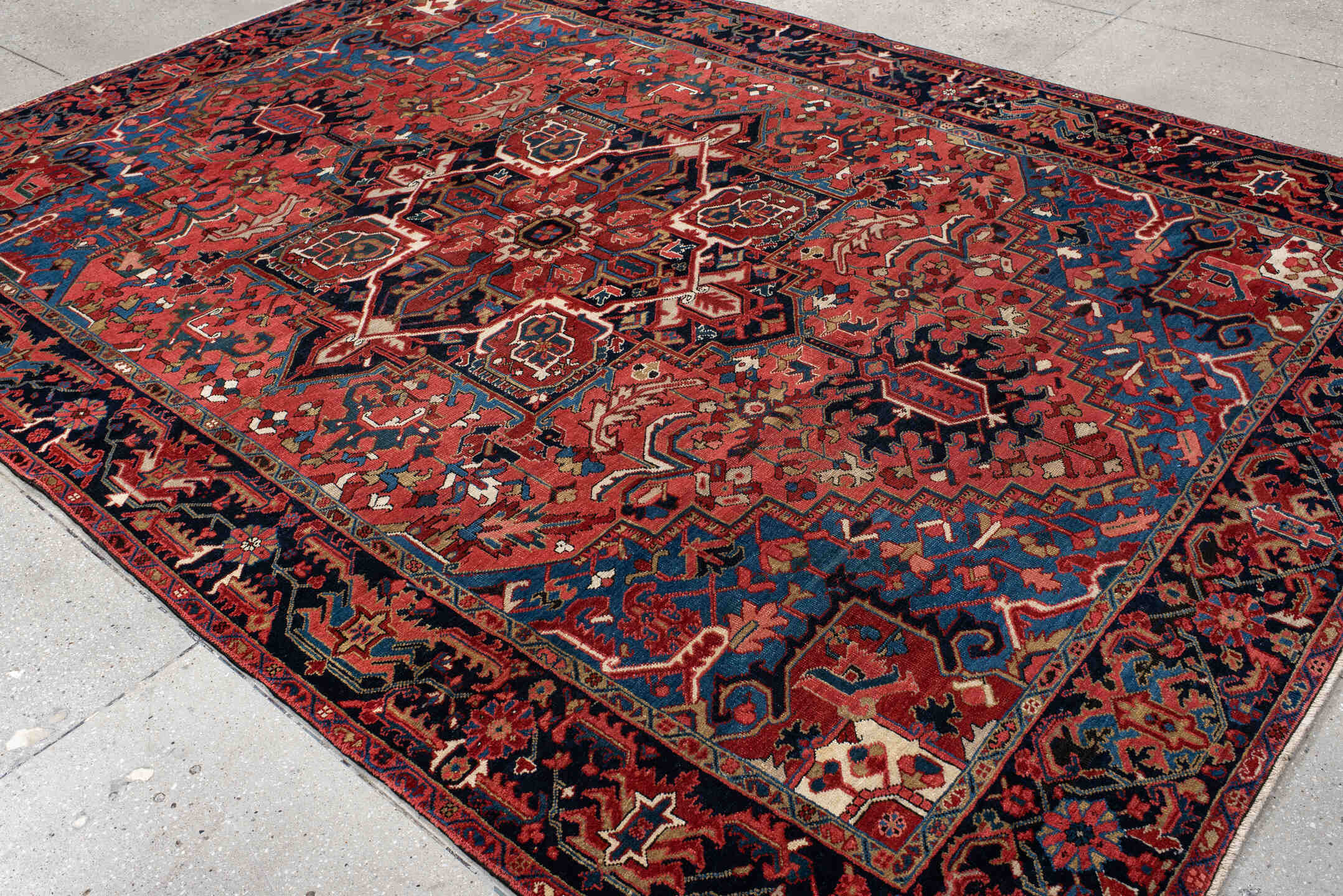 7' x 11' one-of-a-kind handmade antique Heriz large size rug. Color palette: rust, navy, sky_blue, ivory, brick, coral