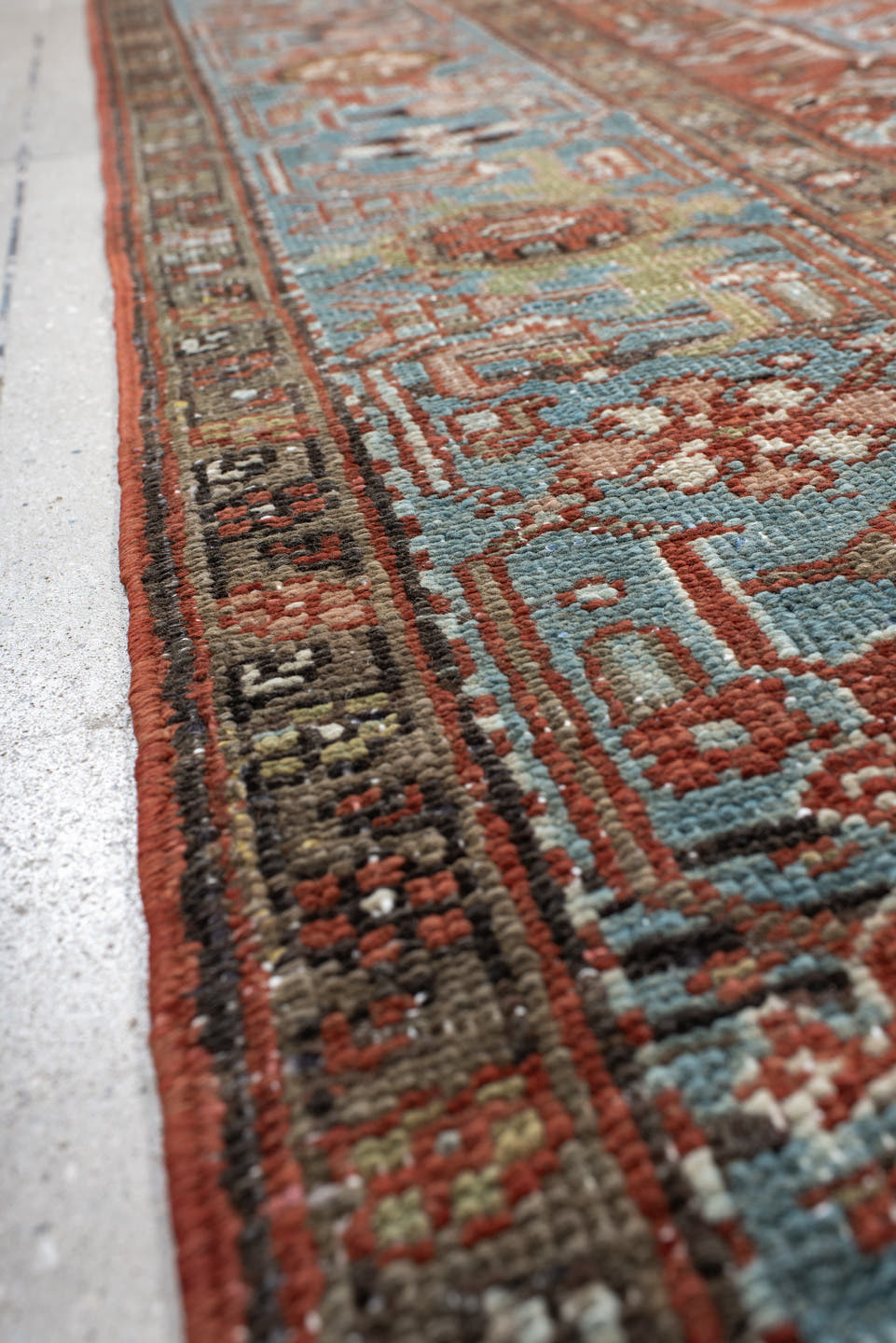 7' x 11' one-of-a-kind handmade antique Heriz large size rug. Color palette: rust, sky blue, ivory, taupe, charcoal, camel